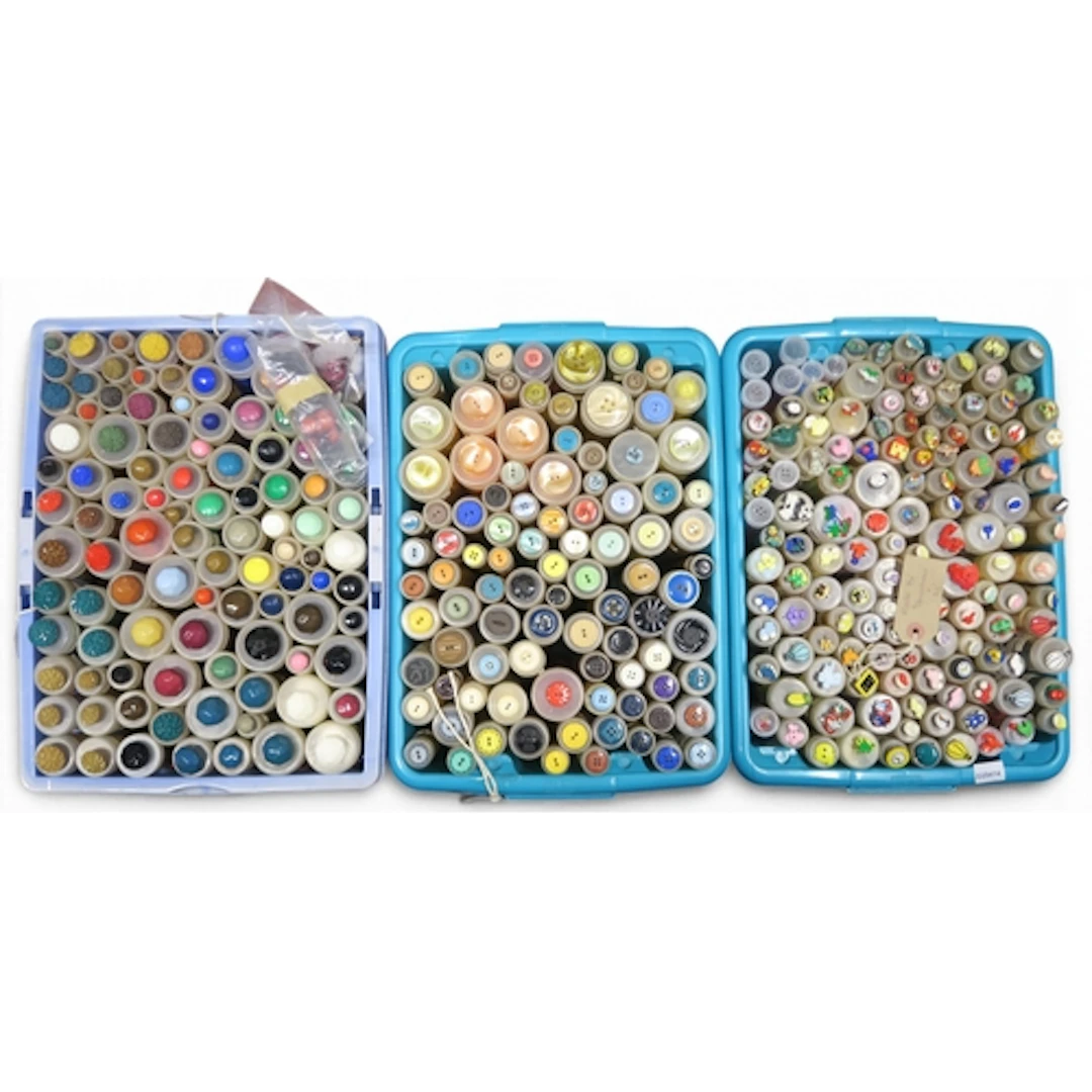 A large collection of assorted buttons to include flat and s...