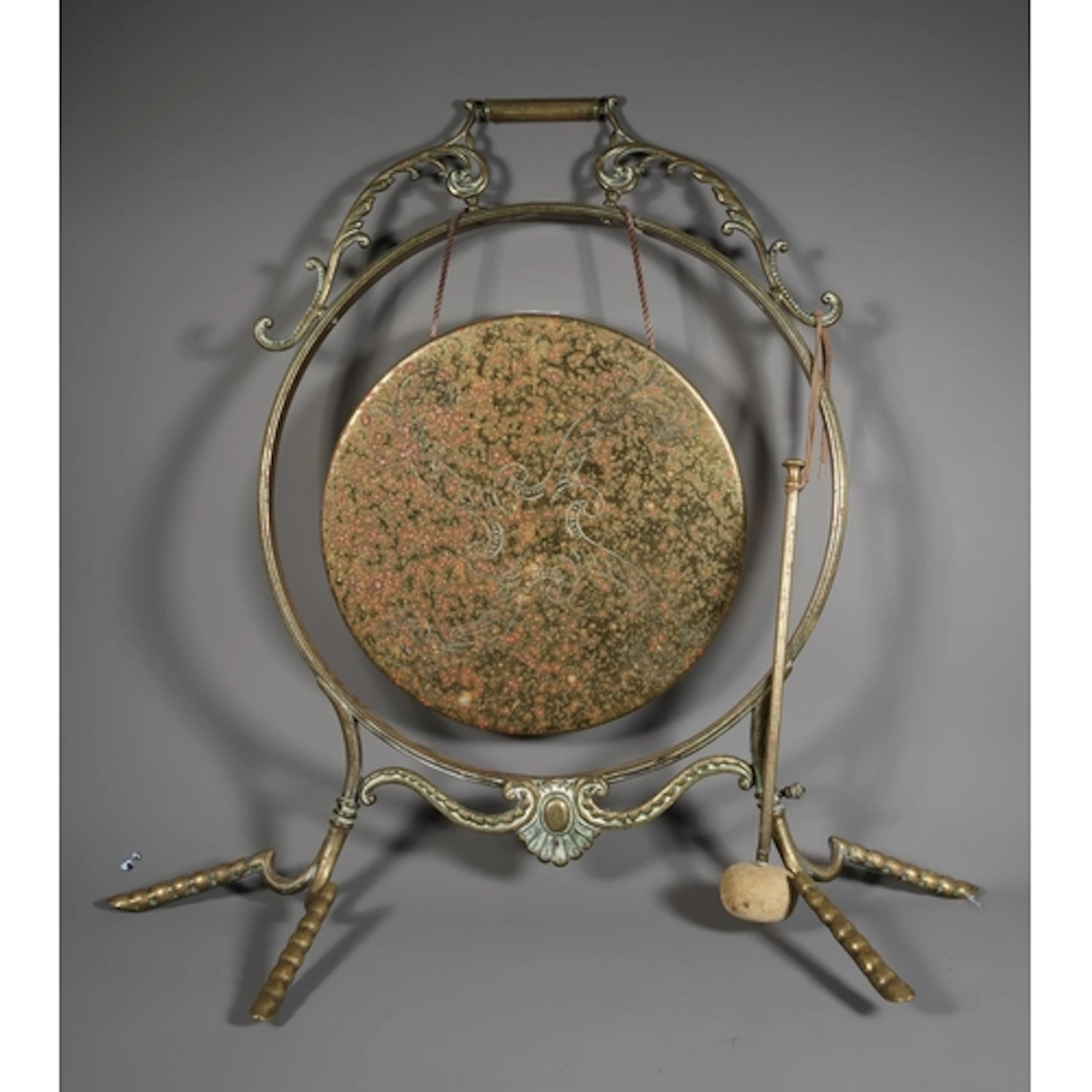Brass dinner gong on stand with beater, 69cm tall.