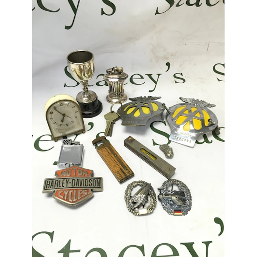 A collection of vintage items including two AA badges, small...