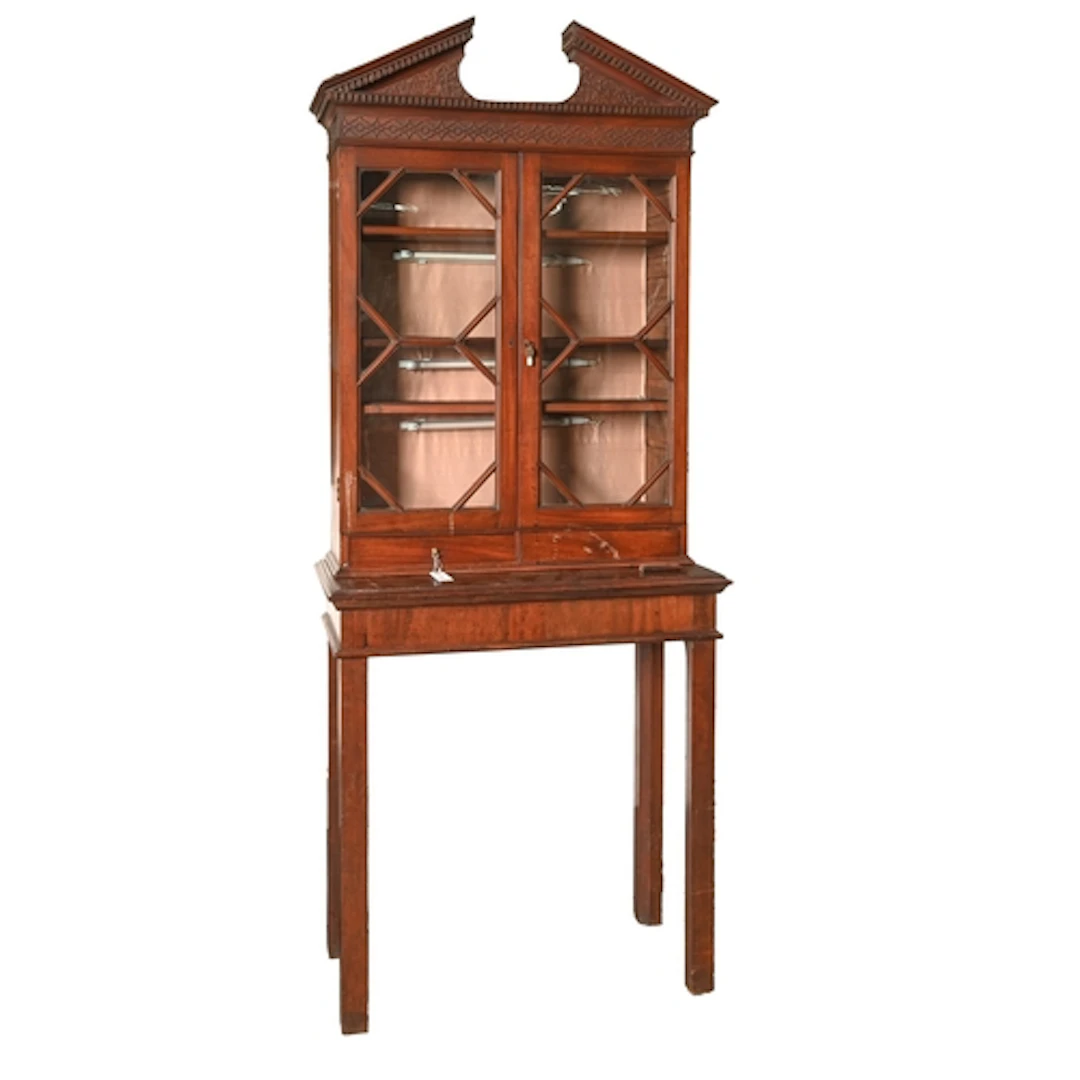 A George III mahogany cabinet, with open dentil pediment and...