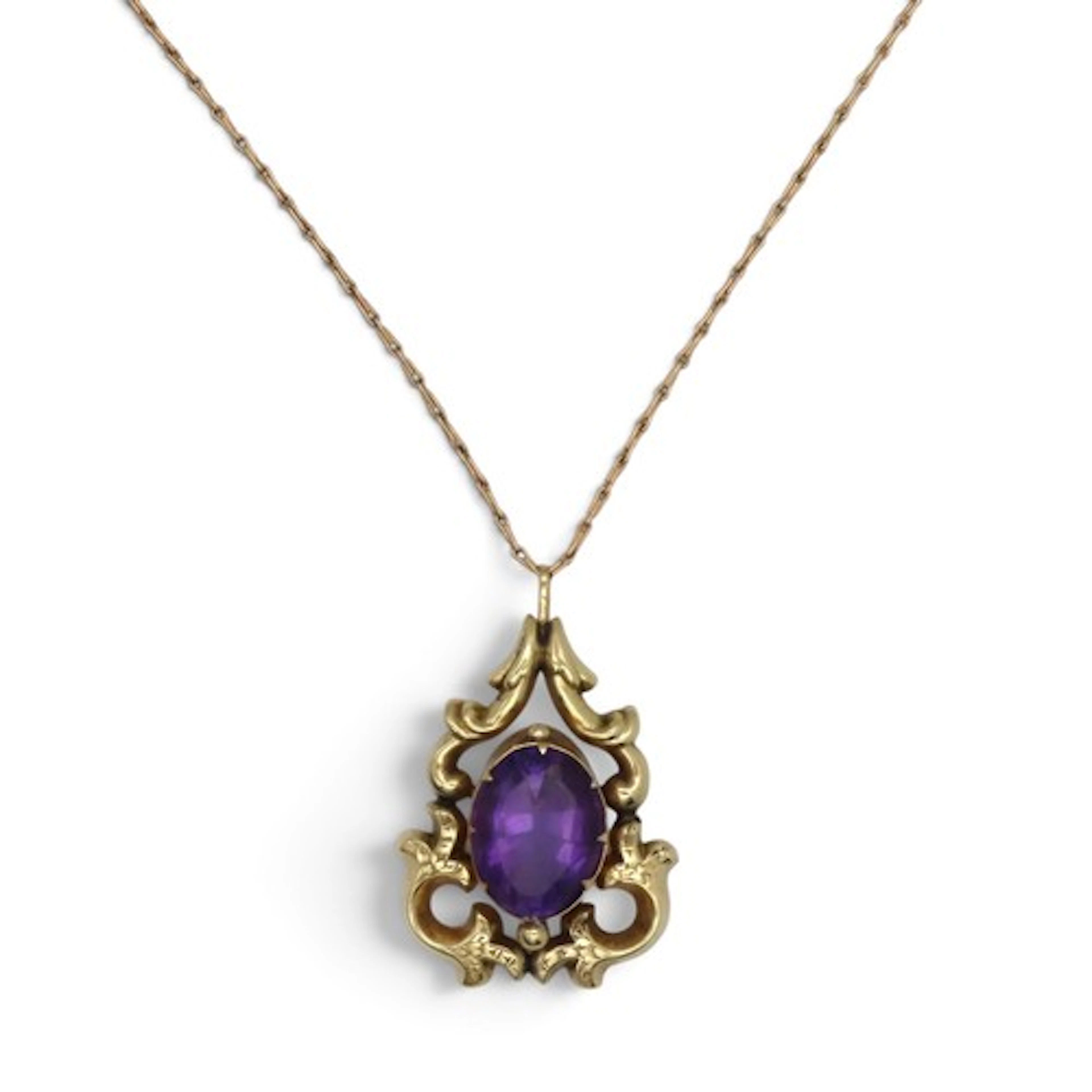A Victorian amethyst pendant, the central oval mixed-cut ame...