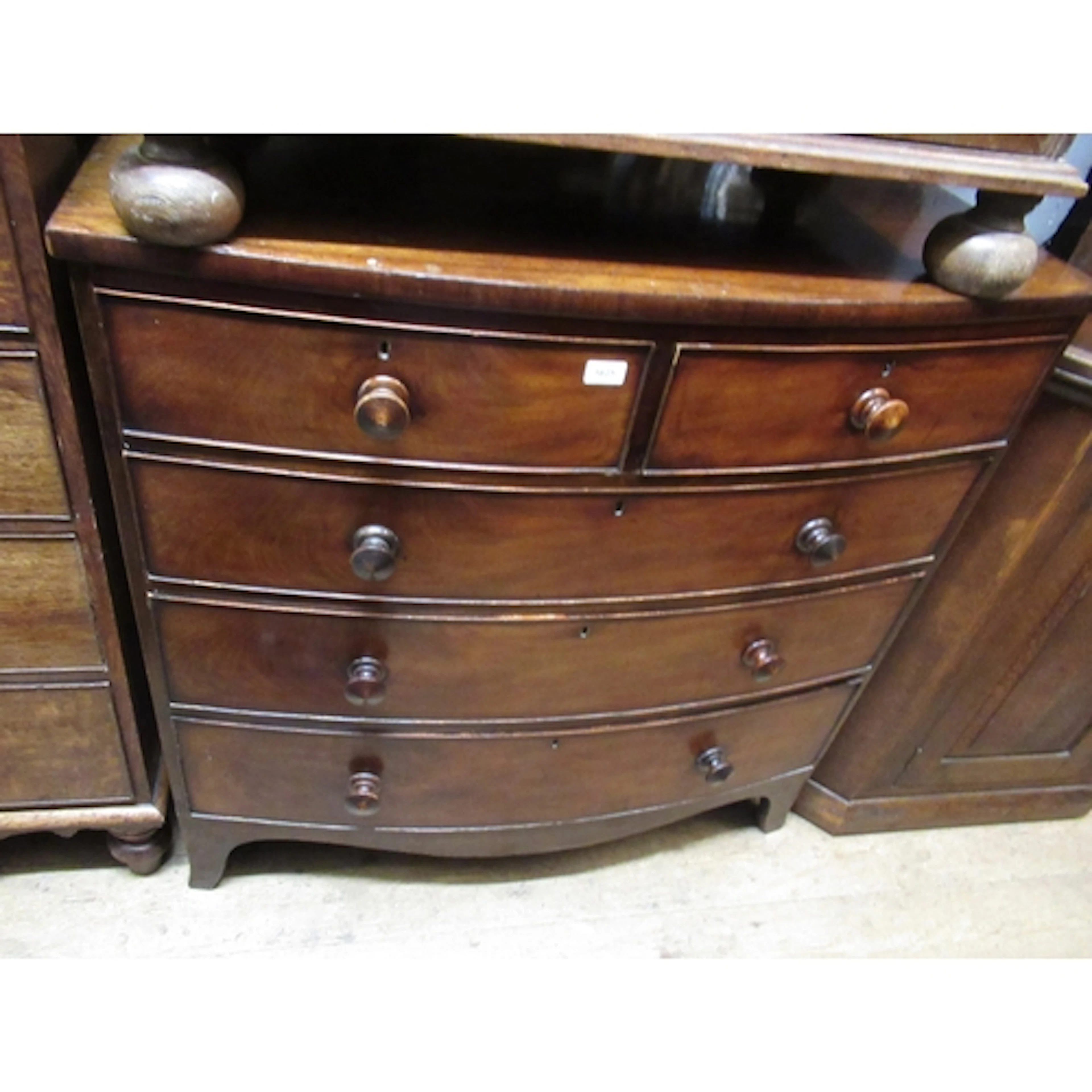 Victorian mahogany bow-front chest, of two short and three l...