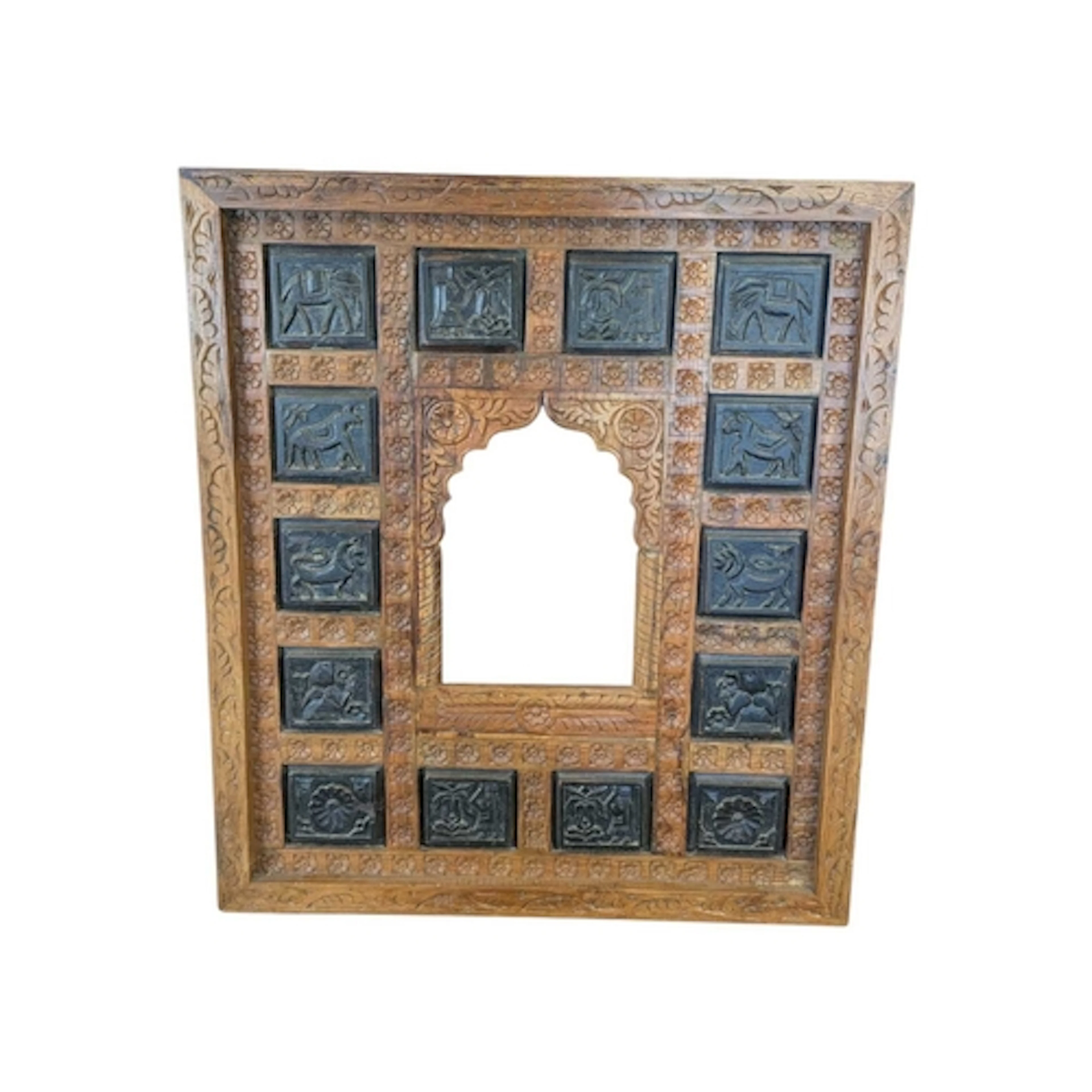 A 20th century Anglo-Indian carved wooden mirror frame. The ...
