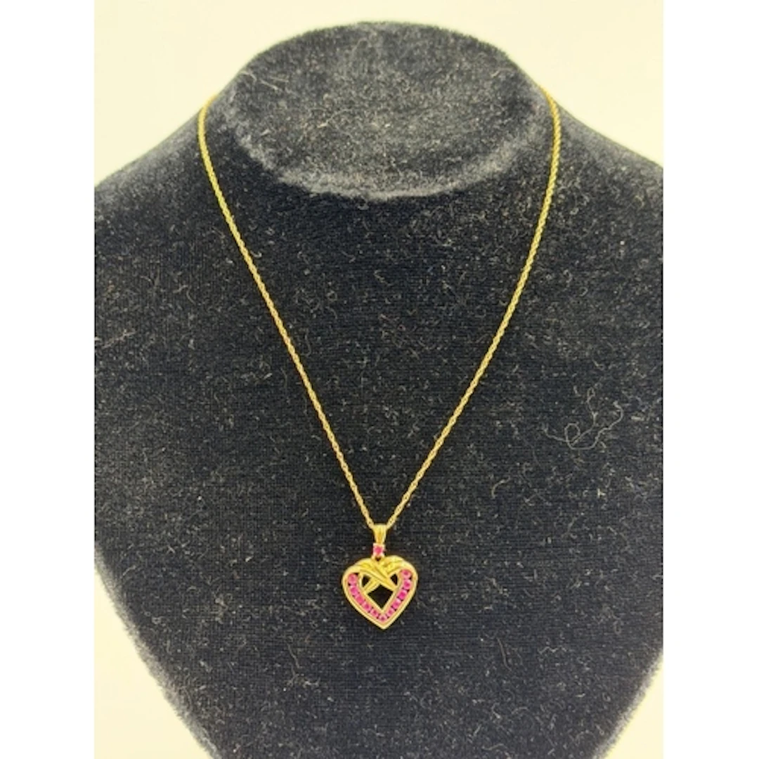 A 9ct gold heart pendant on a fine necklace, approximate wei...