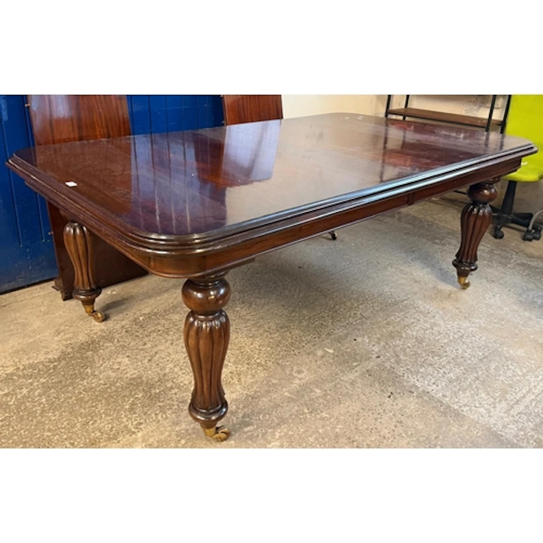 Victorian mahogany extending dining table, with two addition...