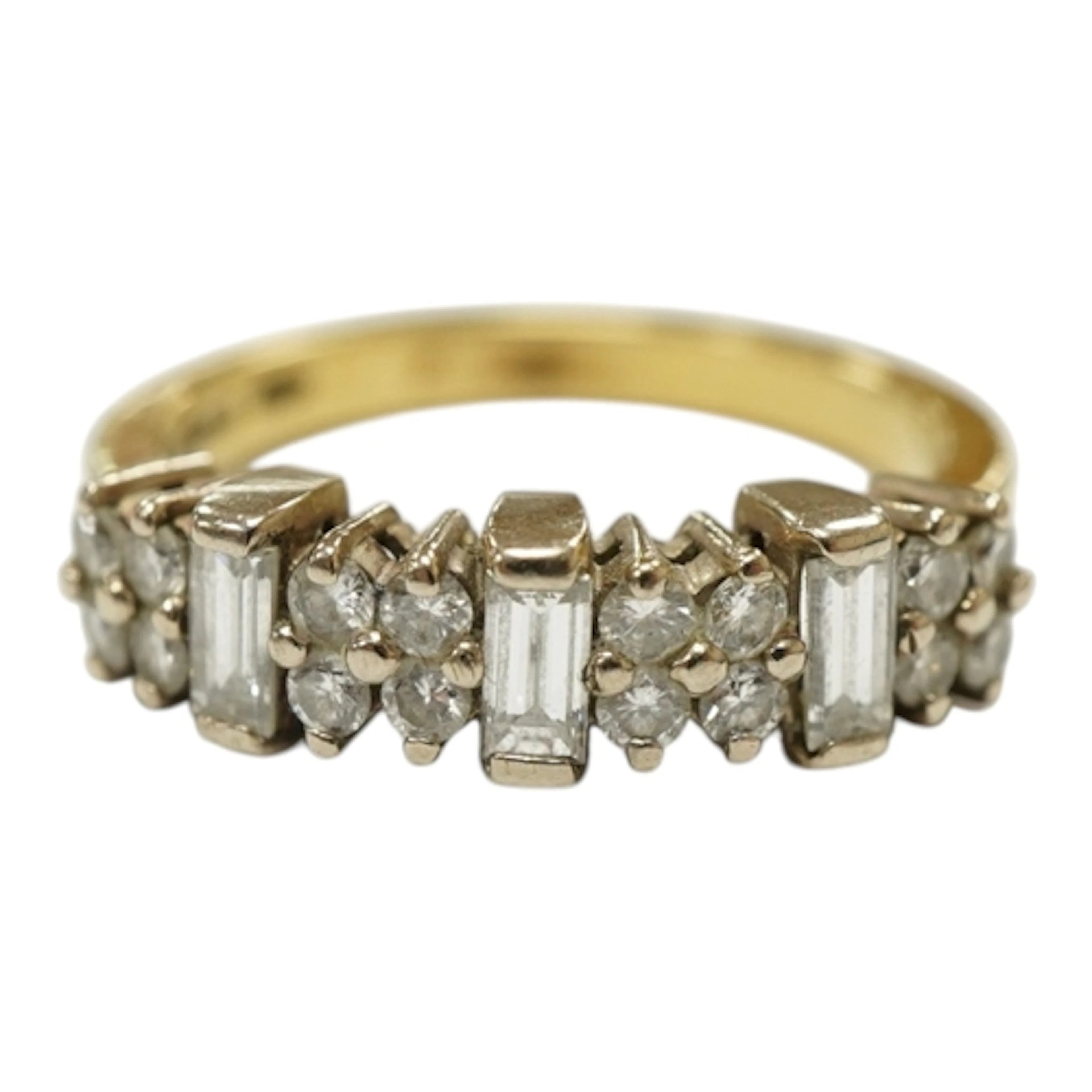 A modern 18ct gold and diamond cluster half hoop ring, set w...