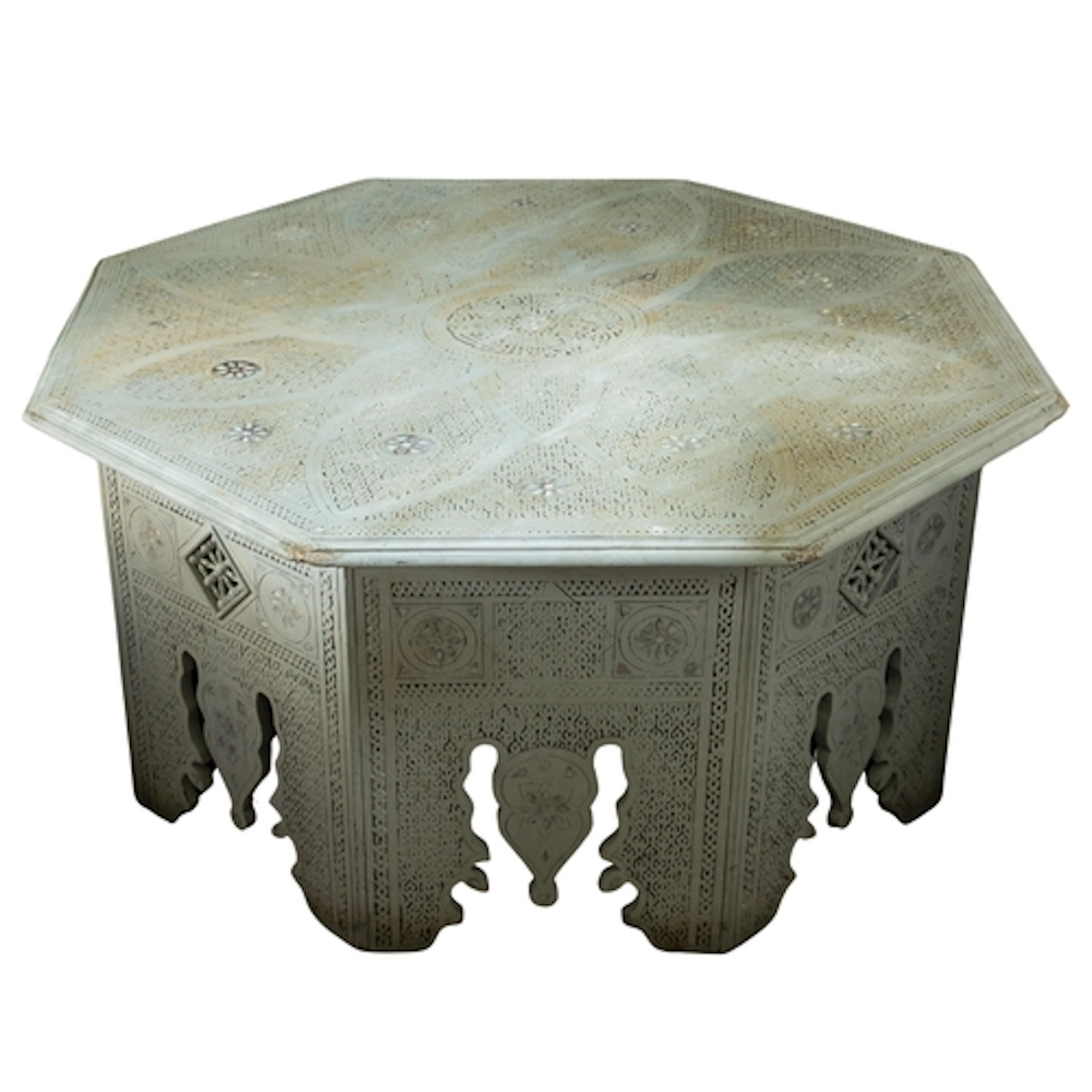 A carved and painted wood octagonal low table, in North Afri...