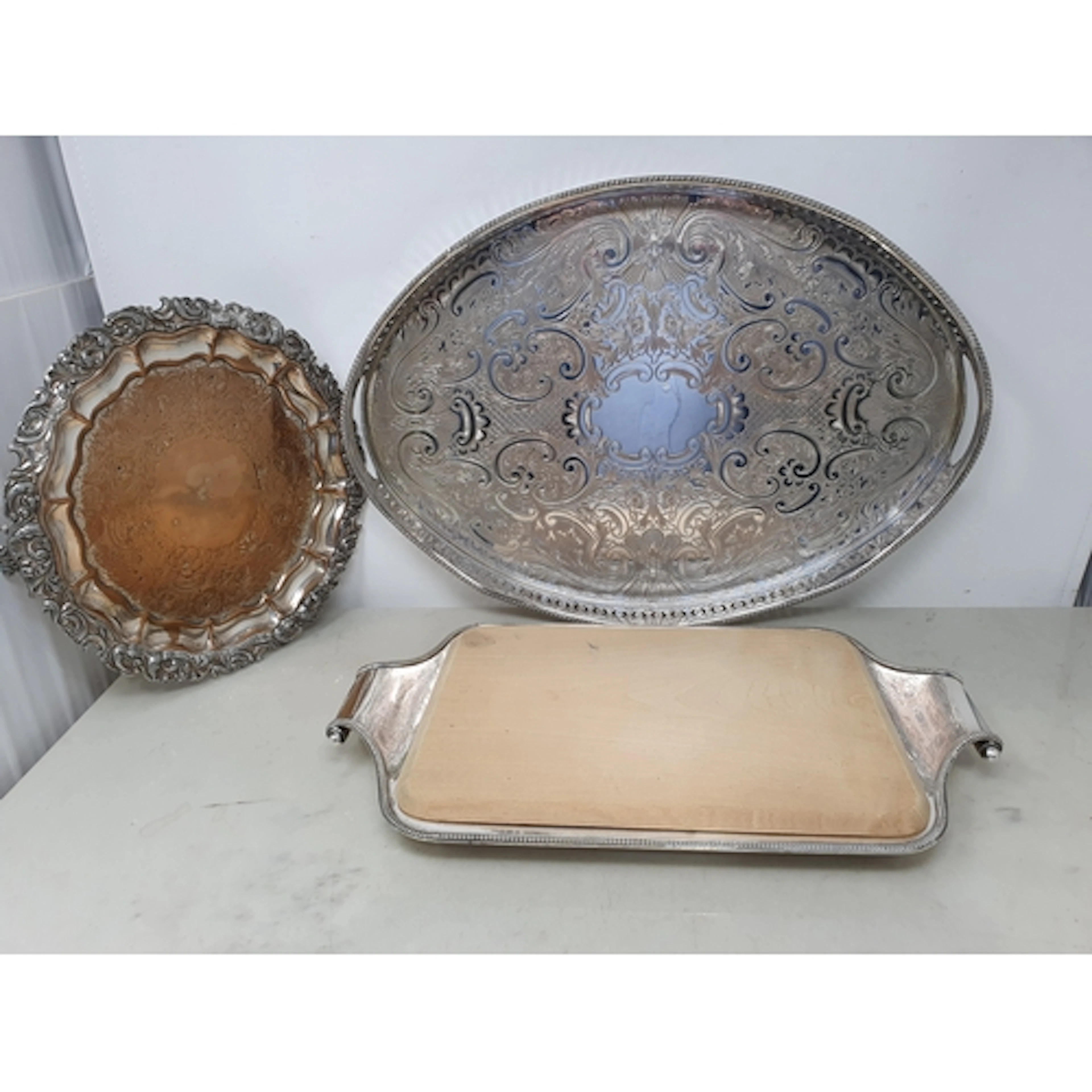 A plated oval Gallery Tray, a Bread Board and a Sheffield pl...