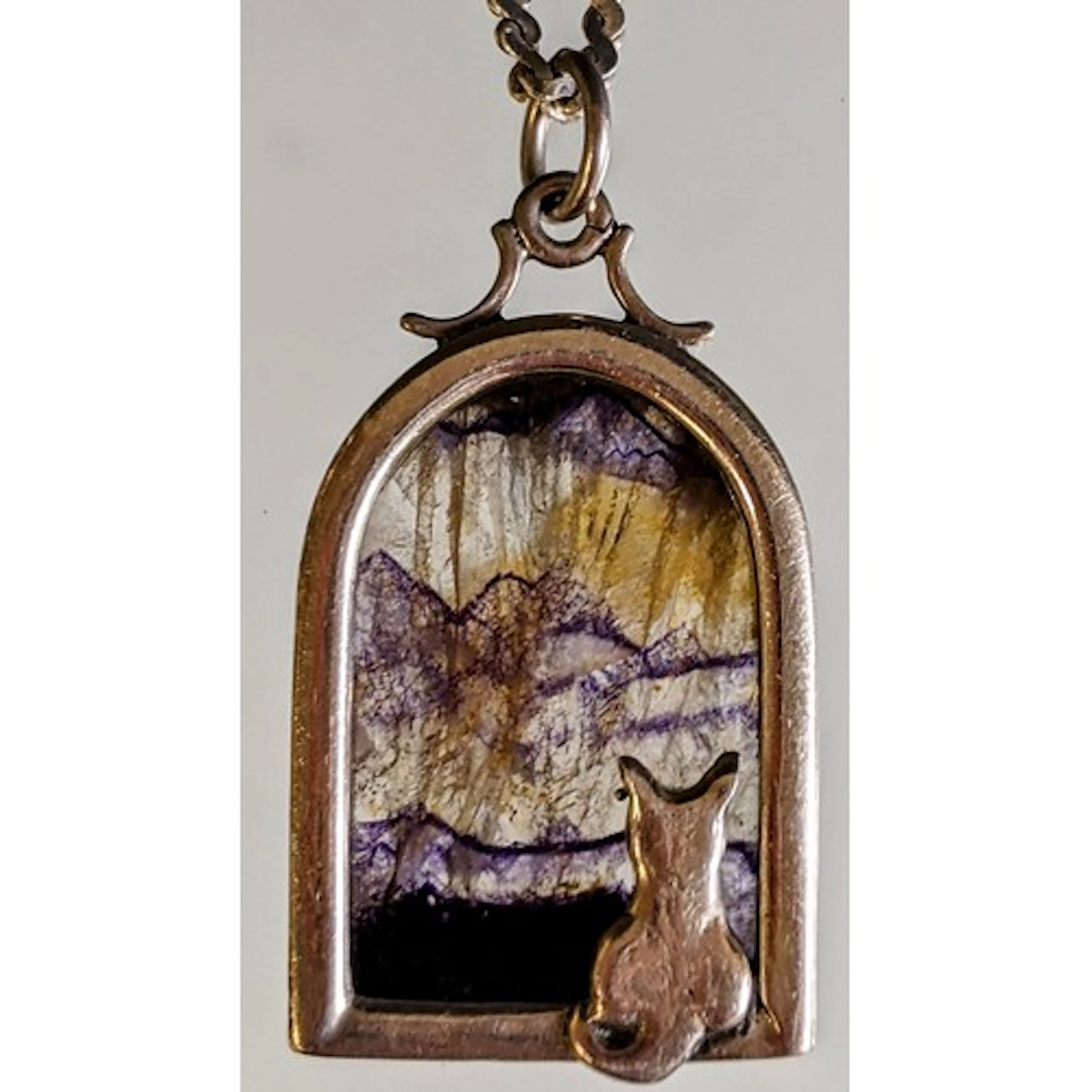 A silver blue john pendant necklace, set with a silver mount...