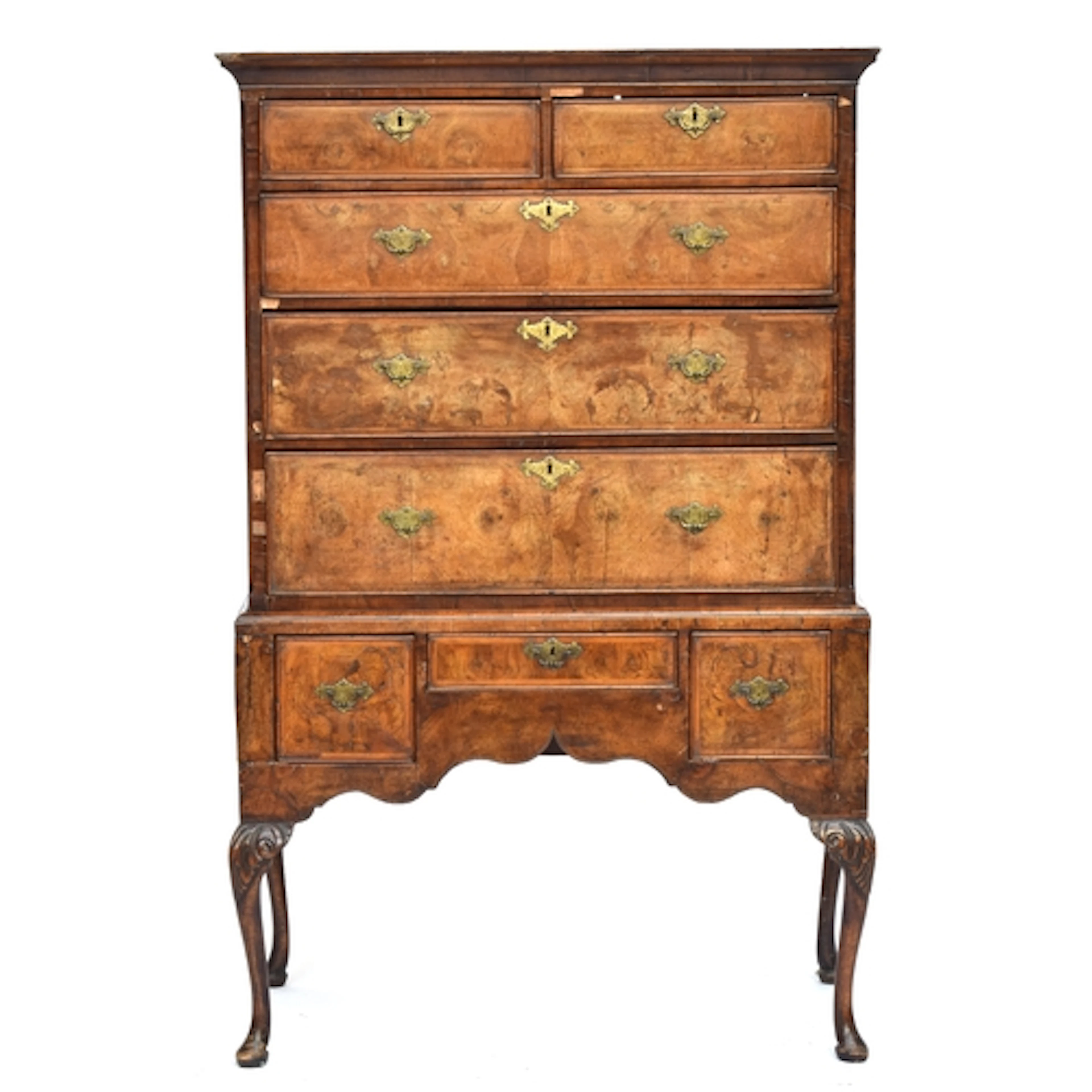 An 18th century walnut chest on stand, the moulded top over ...