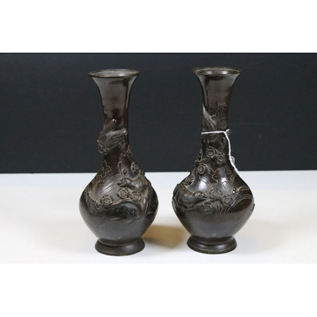 Pair of 19th century Japanese bronze vases, cast in relief w...