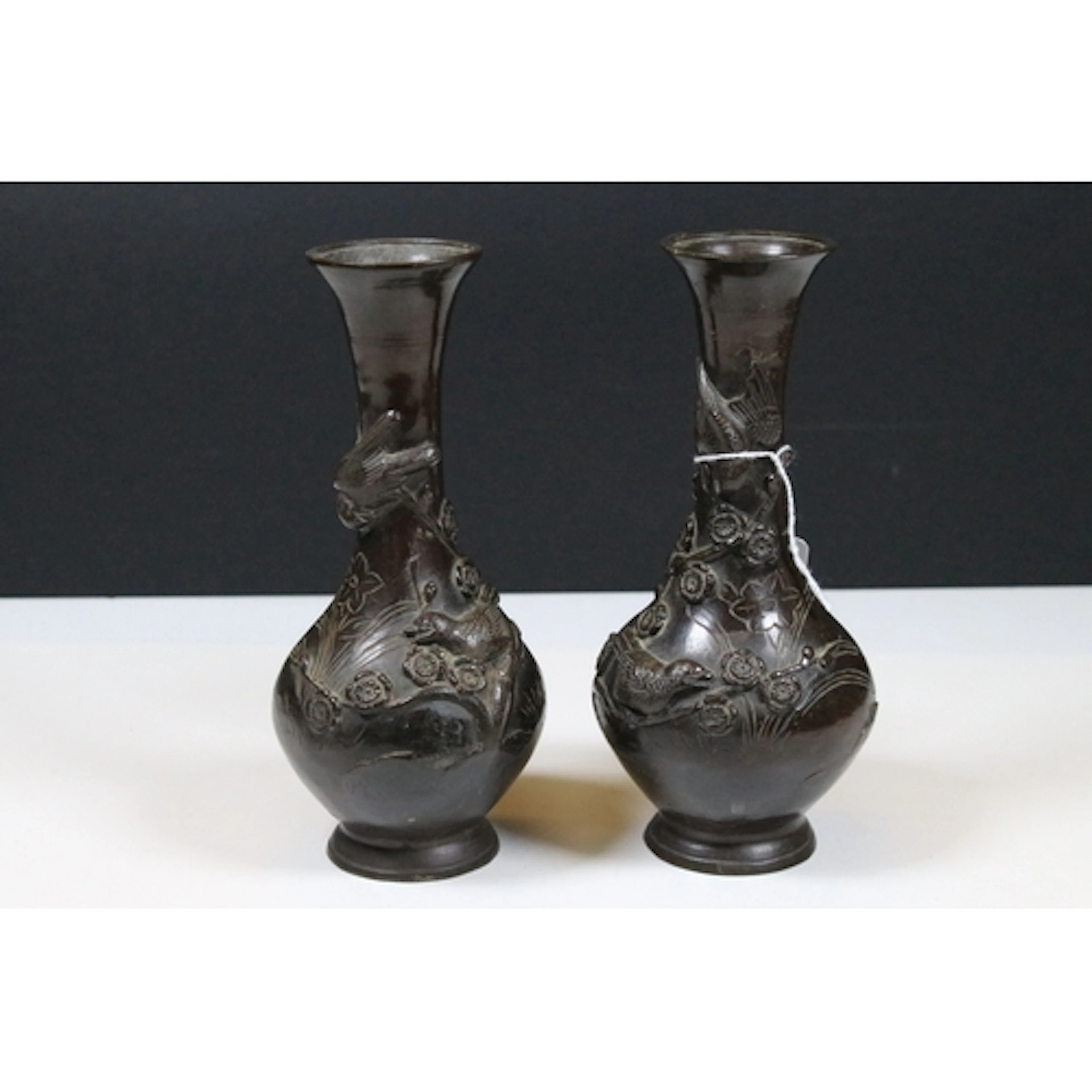 Pair of 19th century Japanese bronze vases, cast in relief w...