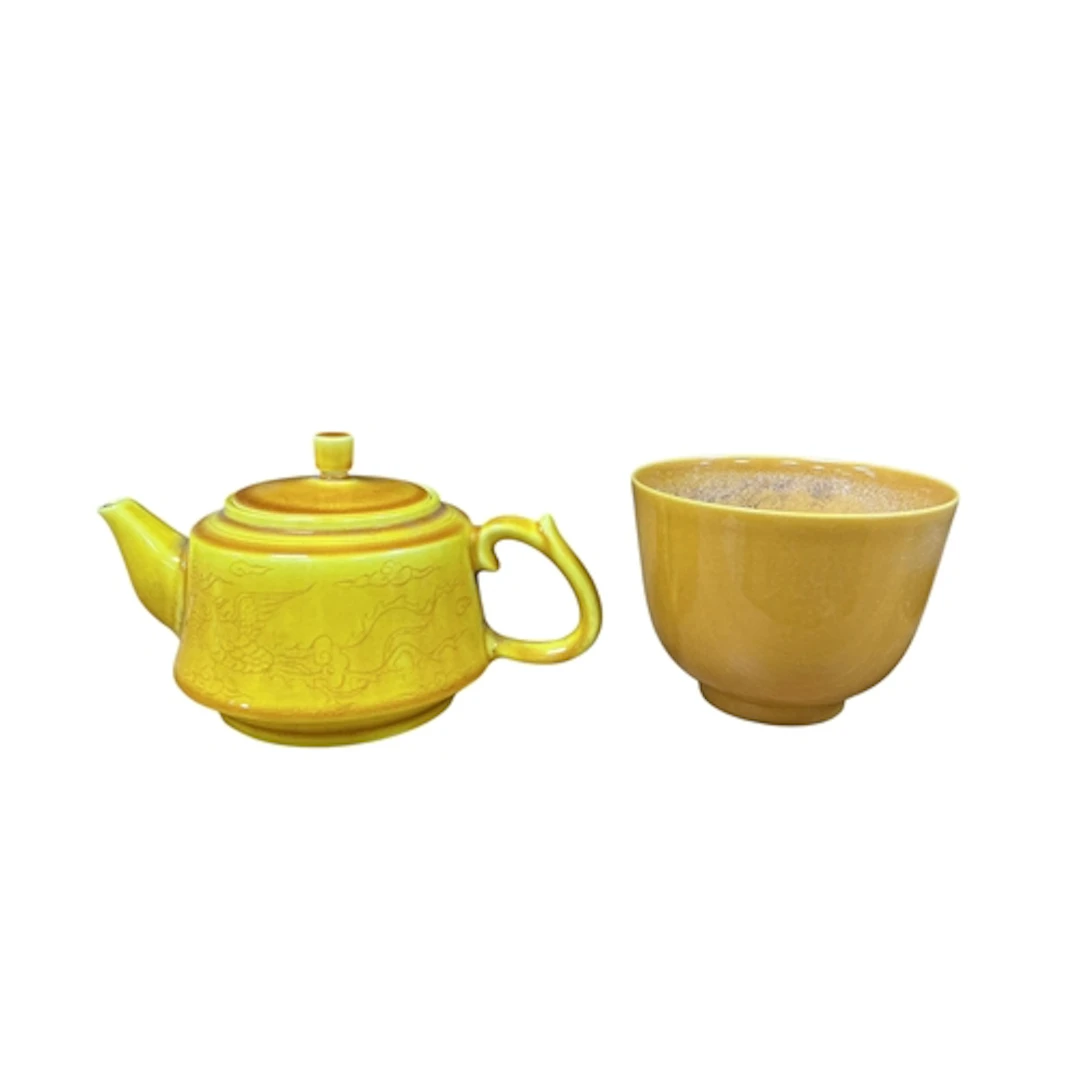 A Chinese yellow glazed cup, Guangru mark and a similar teap...