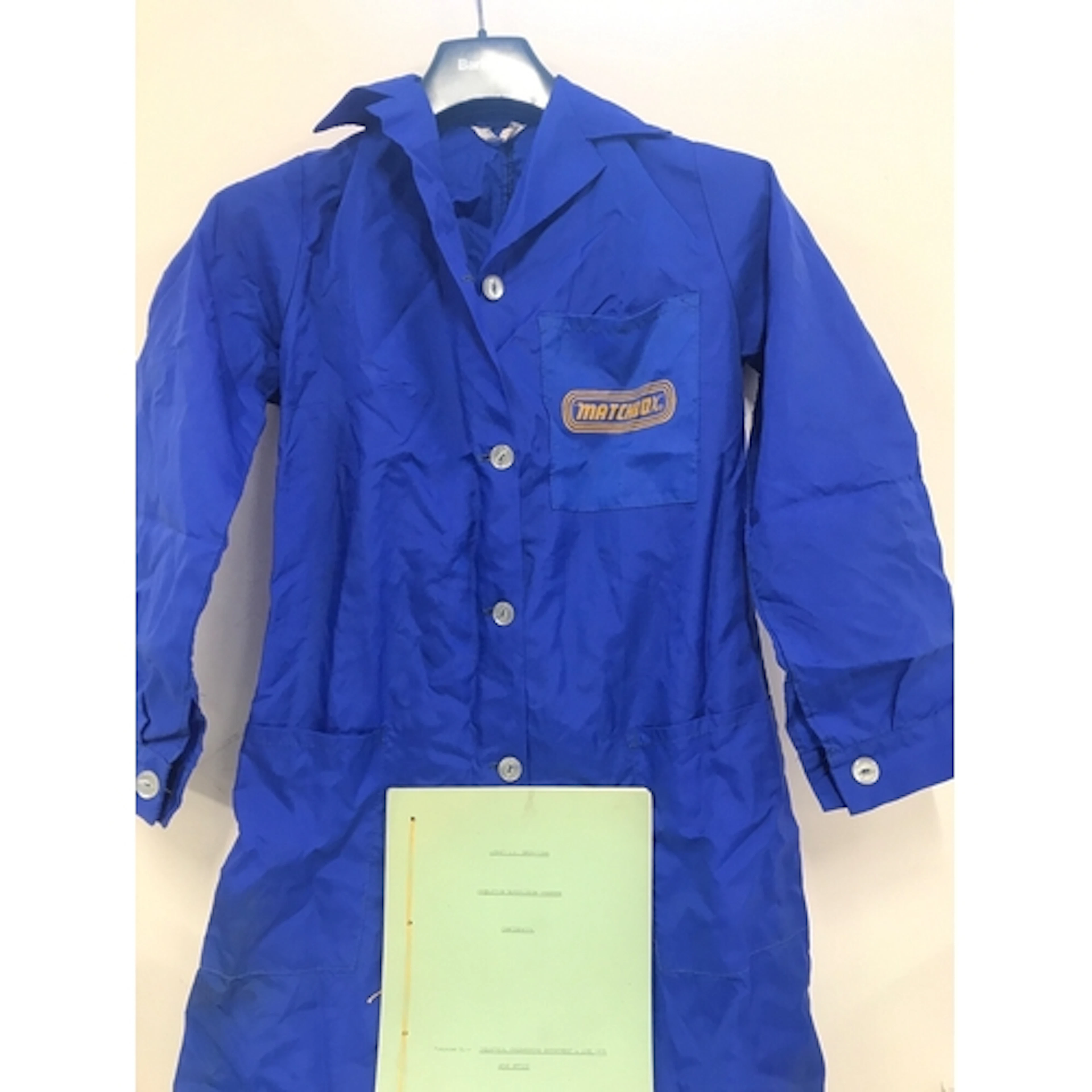 A Matchbox Workwear Lab Coat. Keys. An Order Pad. A Price Li...