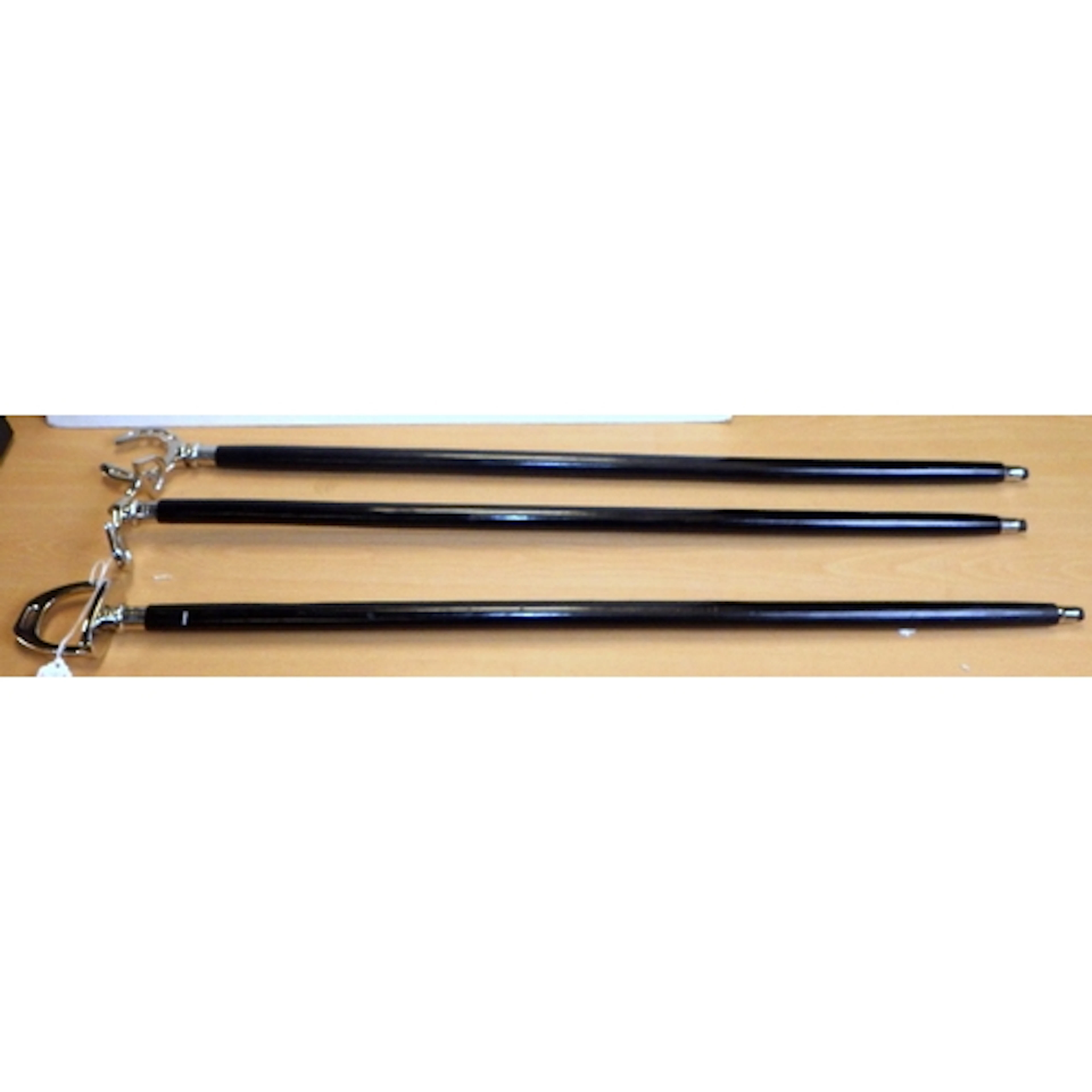 A group of three novelty riding themed walking sticks (3)
