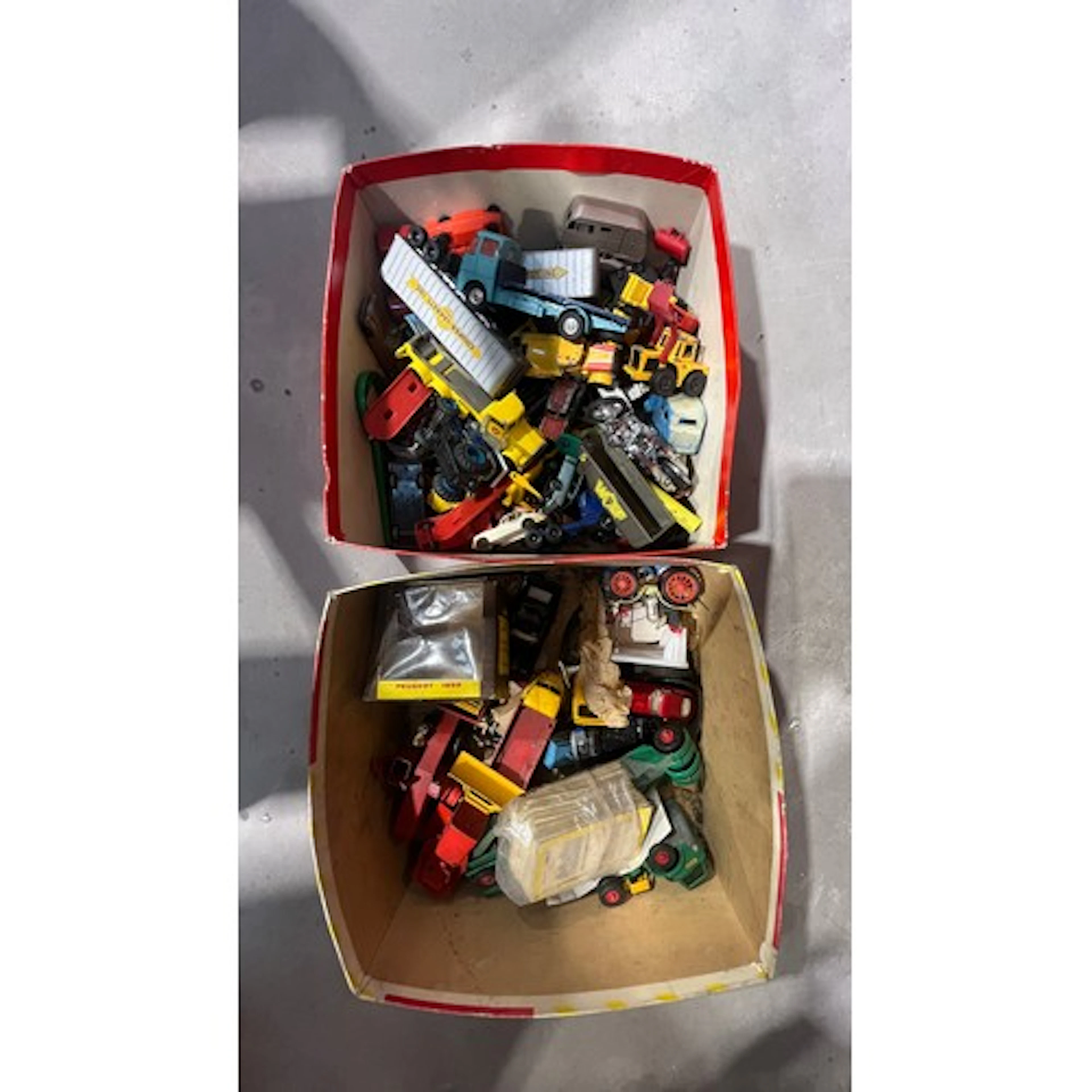 Two small boxes containing loose vehicles to include Matchbo...