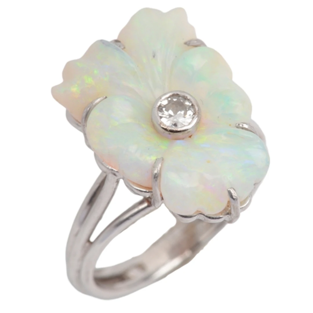 An opal and diamond ring, mid 20th century, set with a secti...