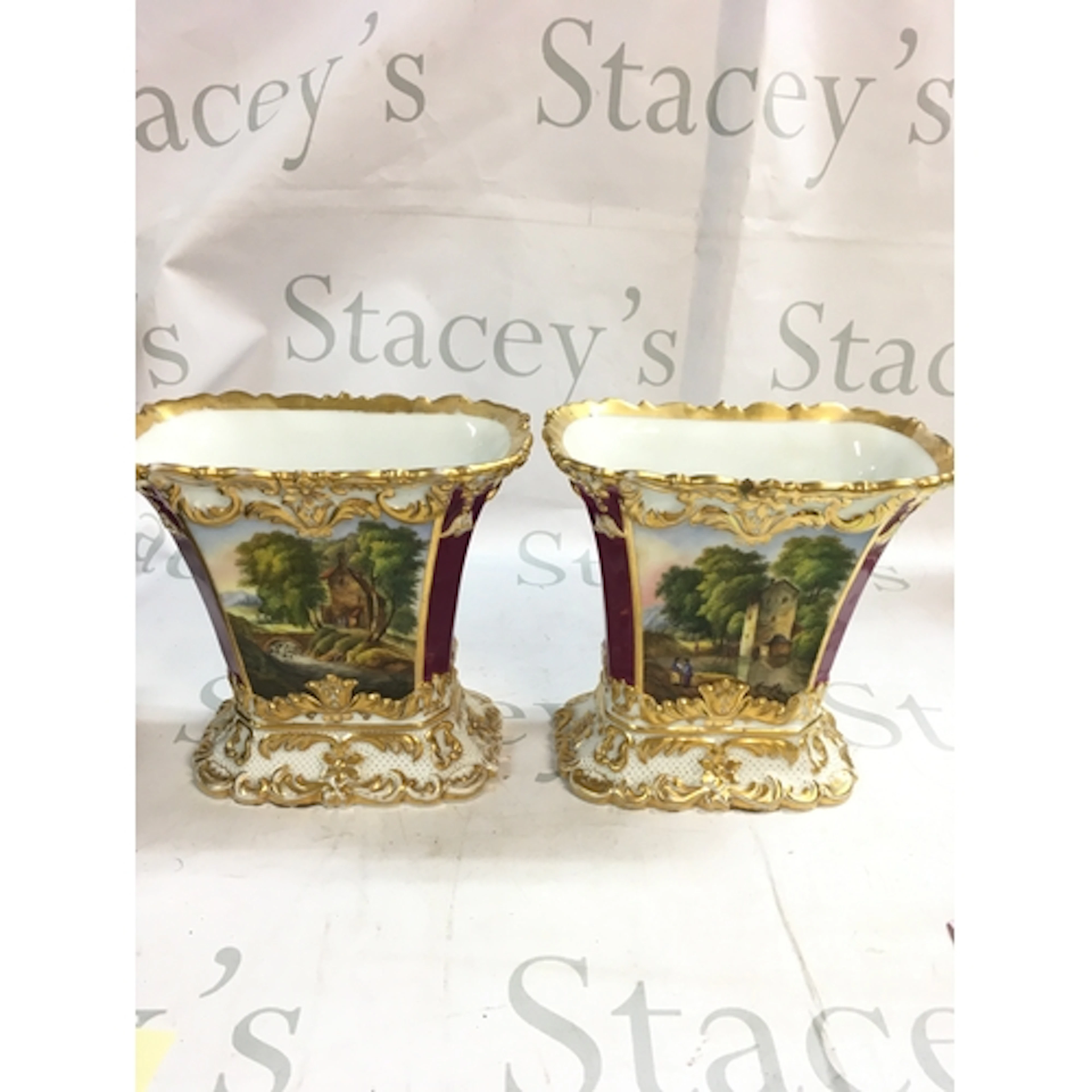 A pair of hand painted vases
