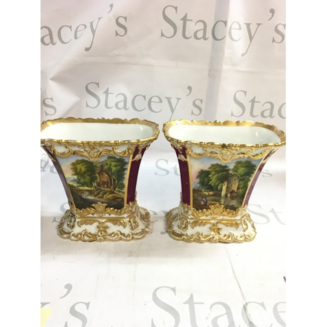 A pair of hand painted vases