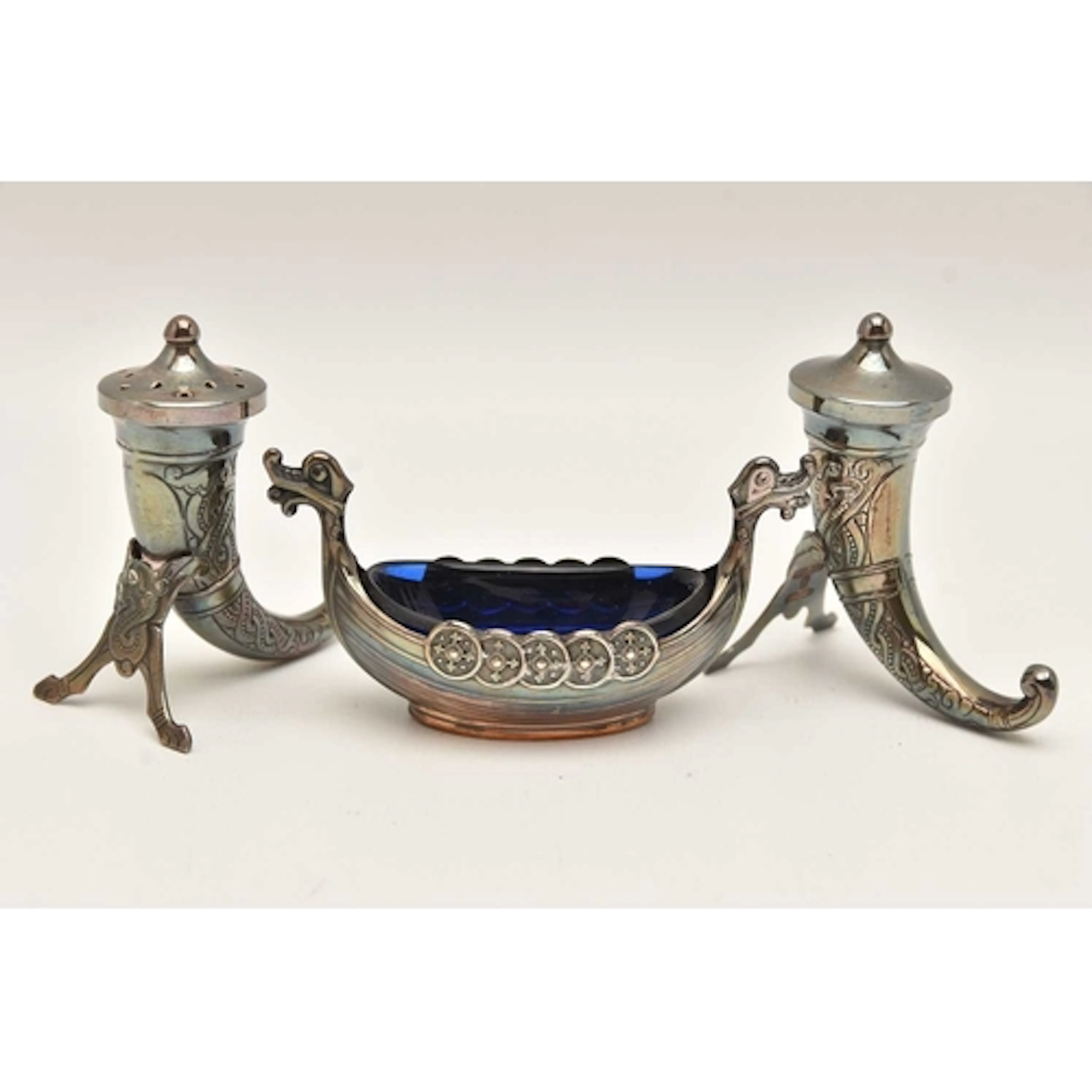 A NORWIGIAN CRUET SET, to include a pair of horn form salt a...