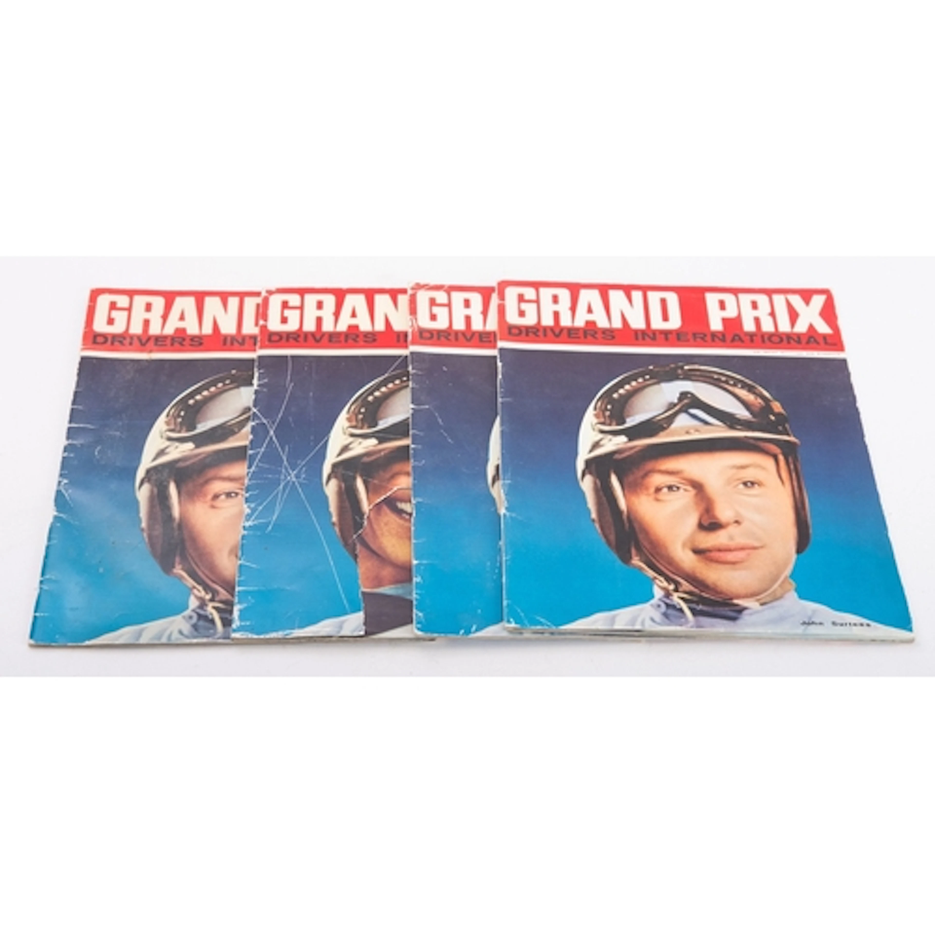 Four copies of ' Grand Prix Driver International' one copy w...