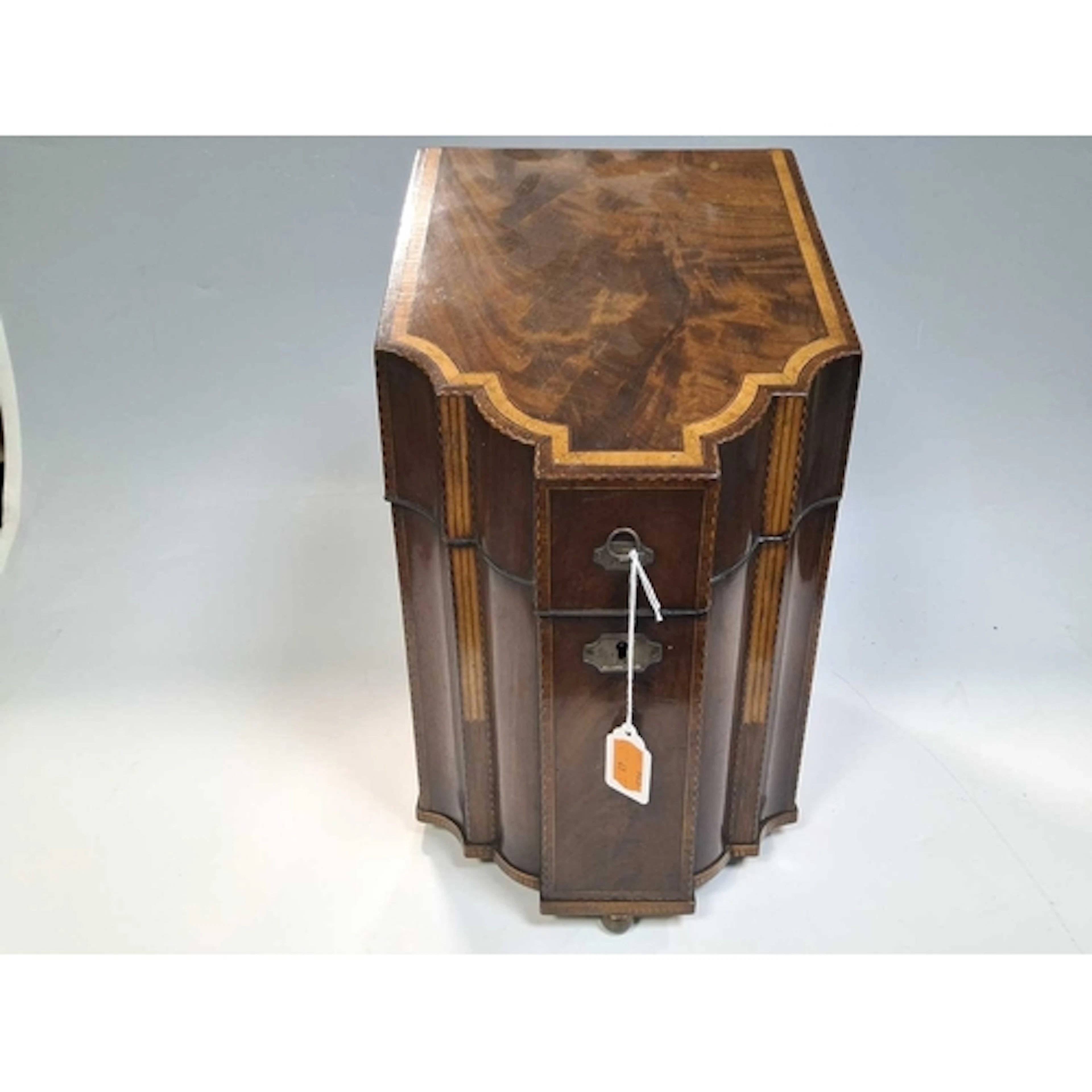 A GEORGIAN KNIFE BOX with a shaped front and intricate inlai...