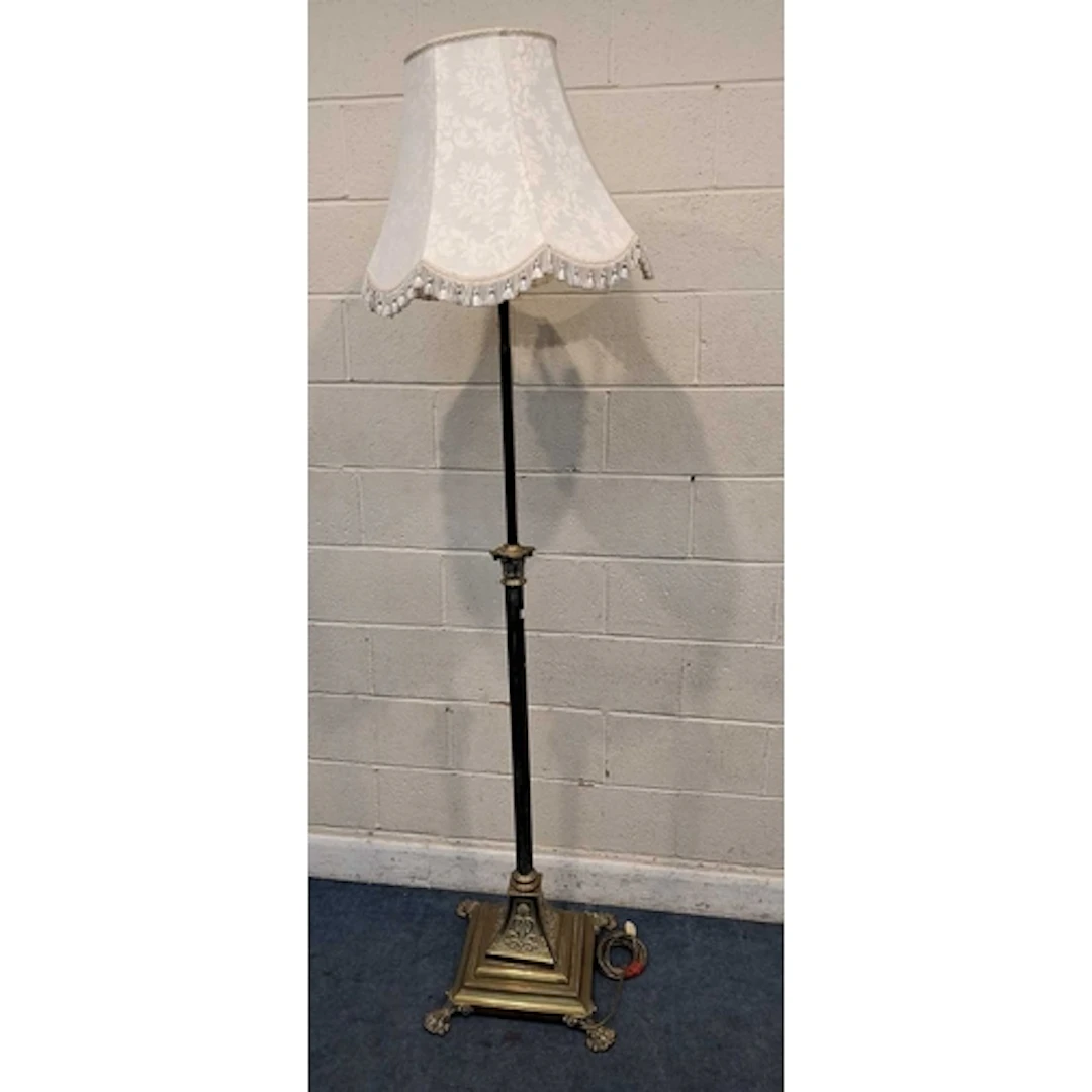 A BRASS TELESCOPIC STANDARD LAMP, with a Corinthian style pi...
