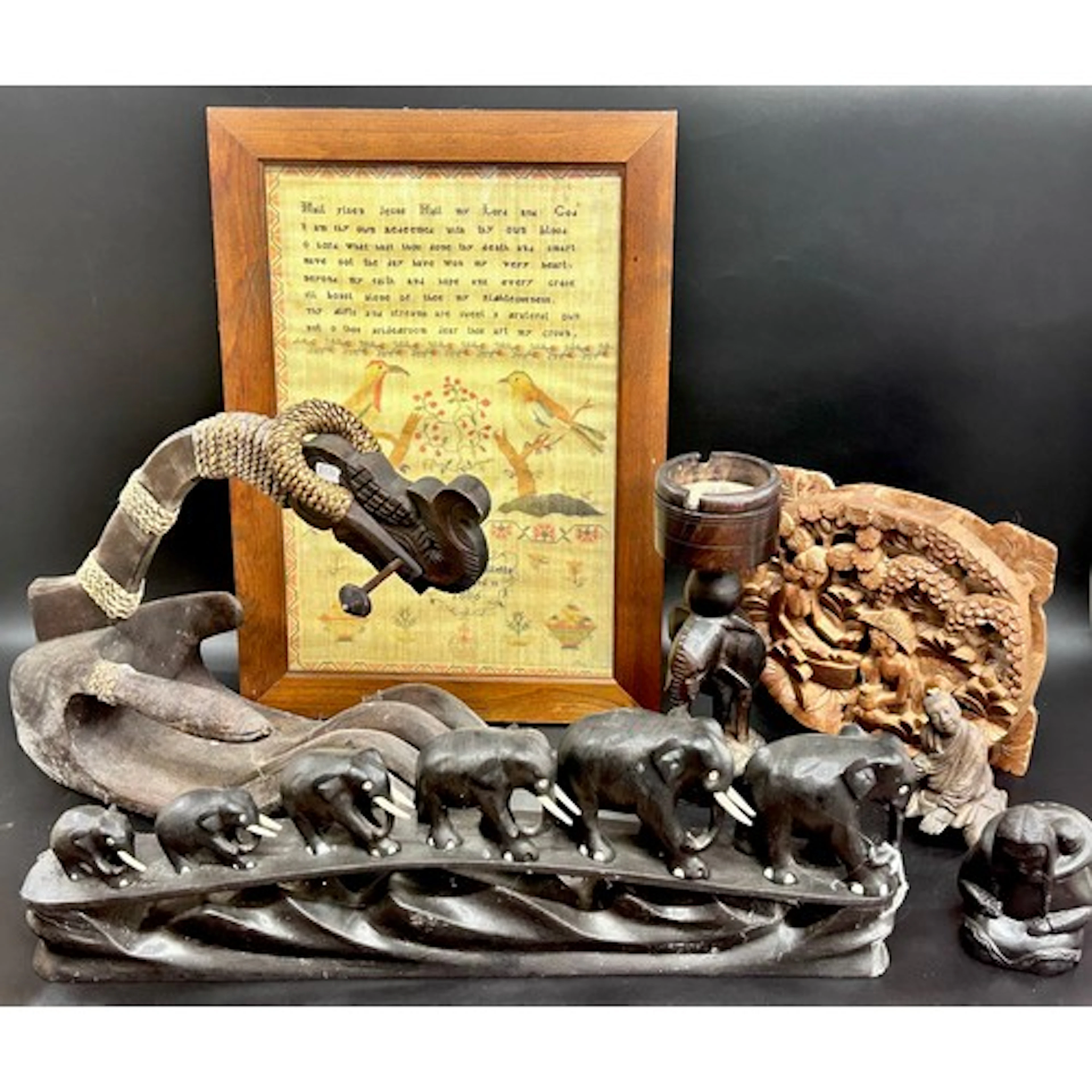A collection of carved wooden items including nut crackers, ...