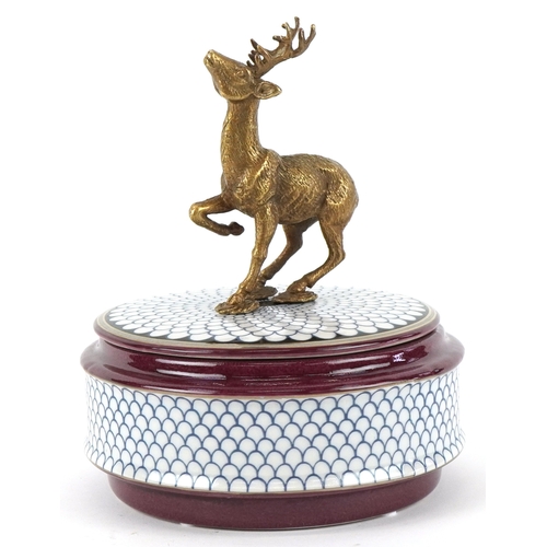 A Wong Lee circular porcelain pot and cover mounted with a b...