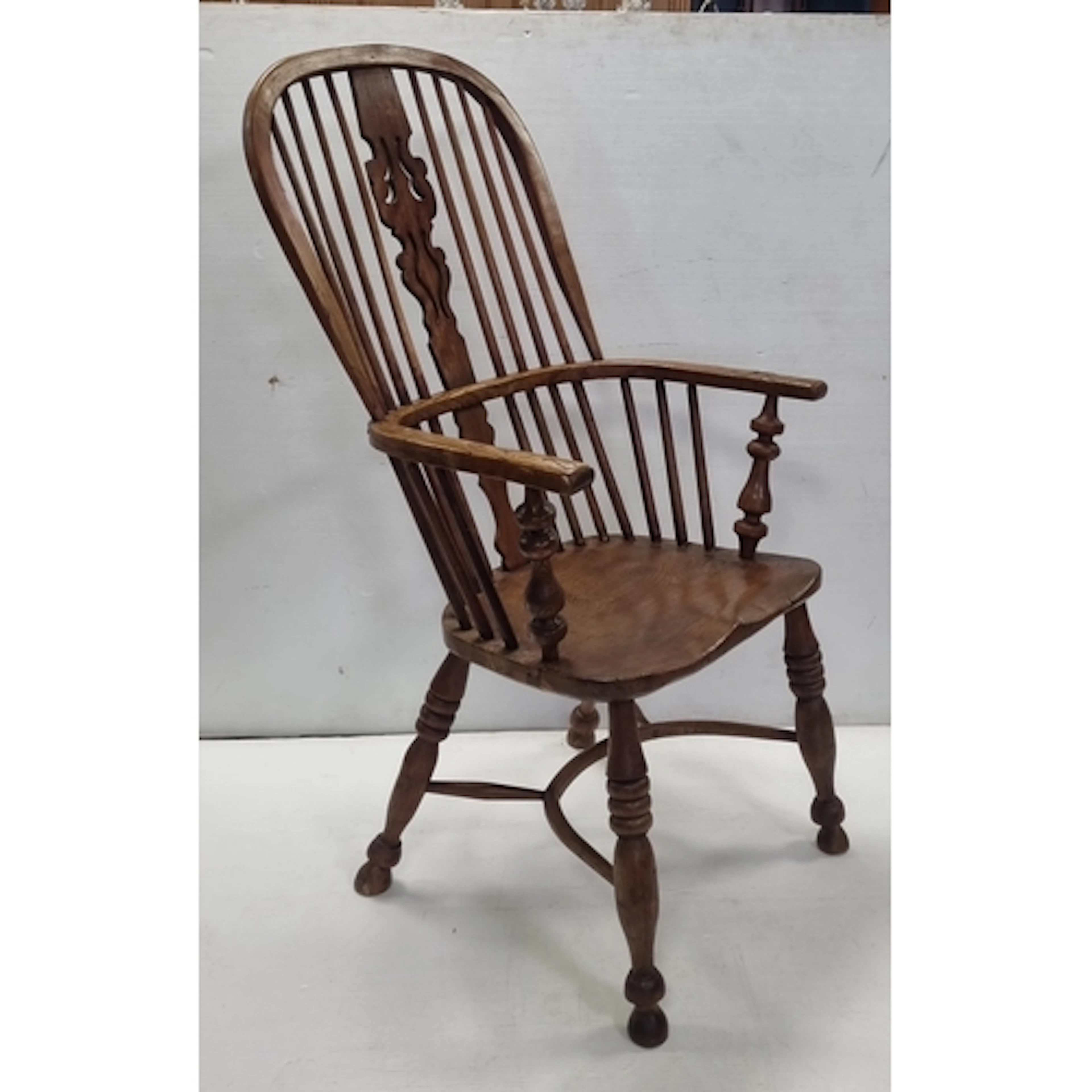 Antique Wooden Windsor Armchair featuring a high spindle ba...