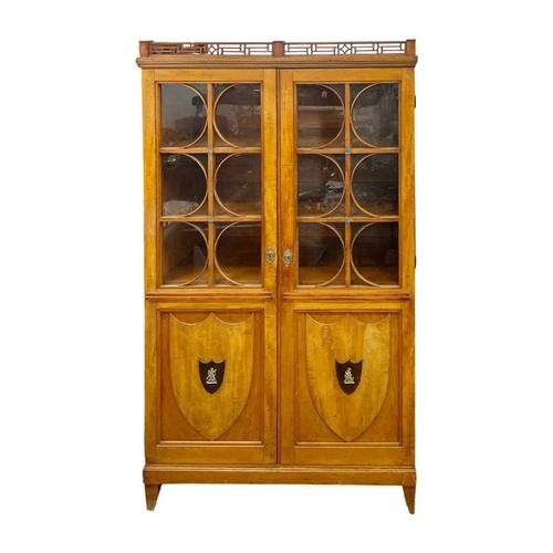 A Biedermeier satin birch display cabinet. Probably Austrian...