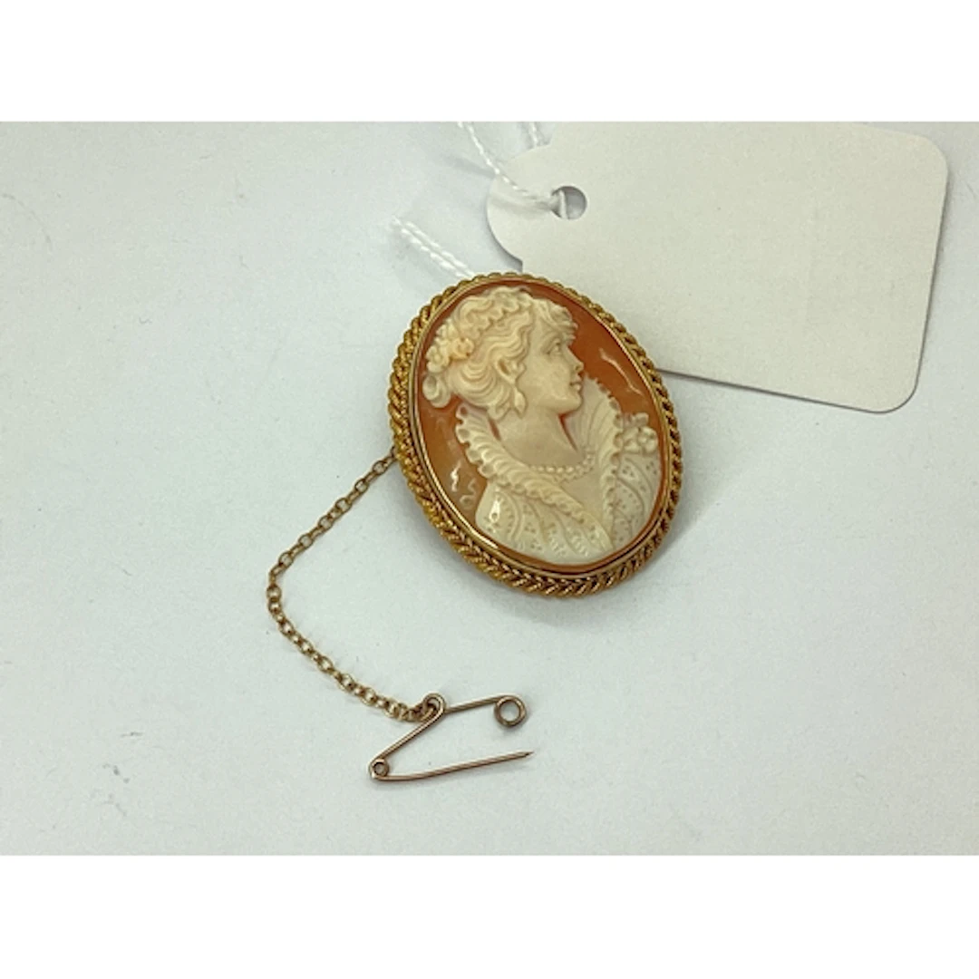 A 9ct Gold Oval Shell Carved Cameo Brooch, depicting female ...