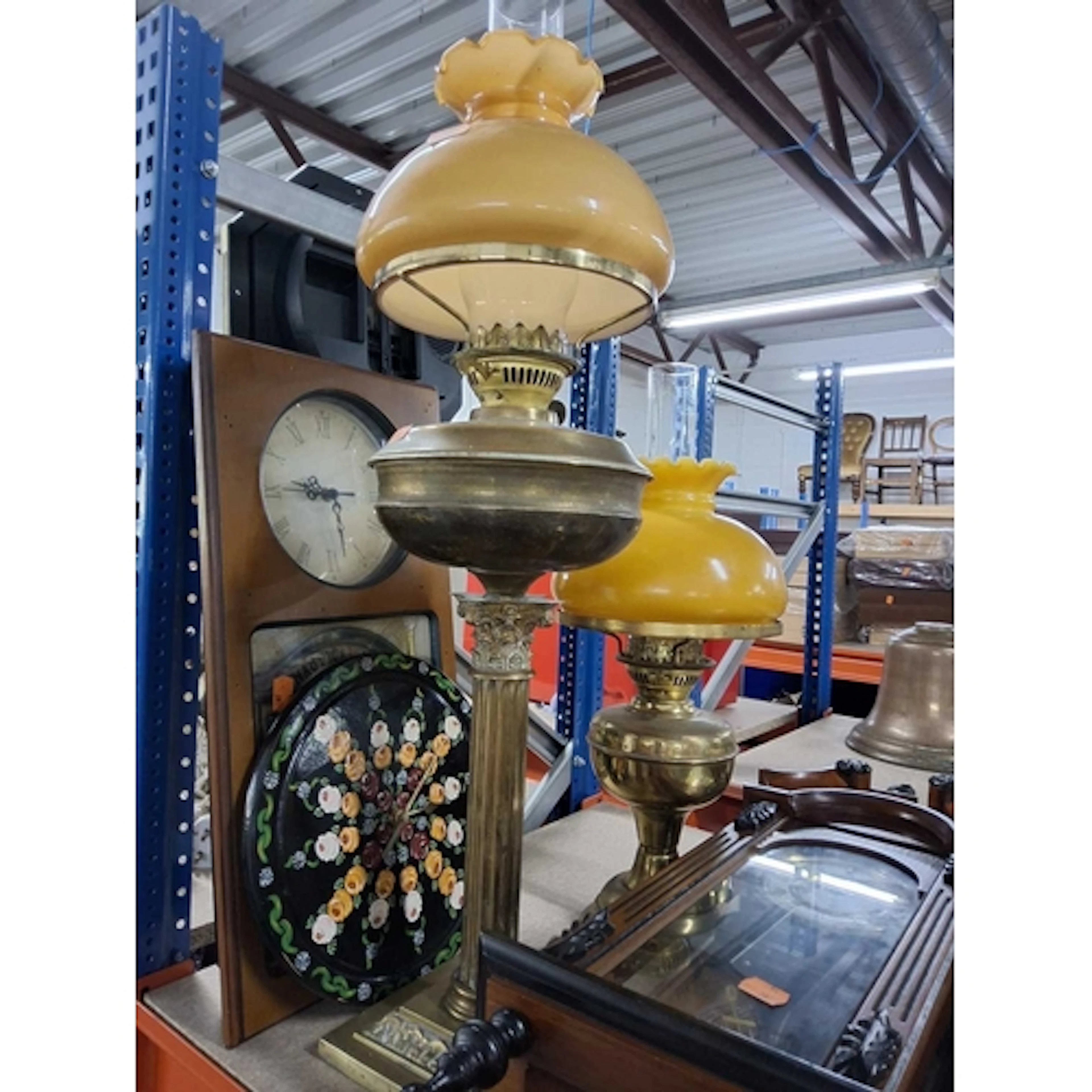 A LARGE GROUP OF CLOCKS, LIGHTING AND VASES to include two o...