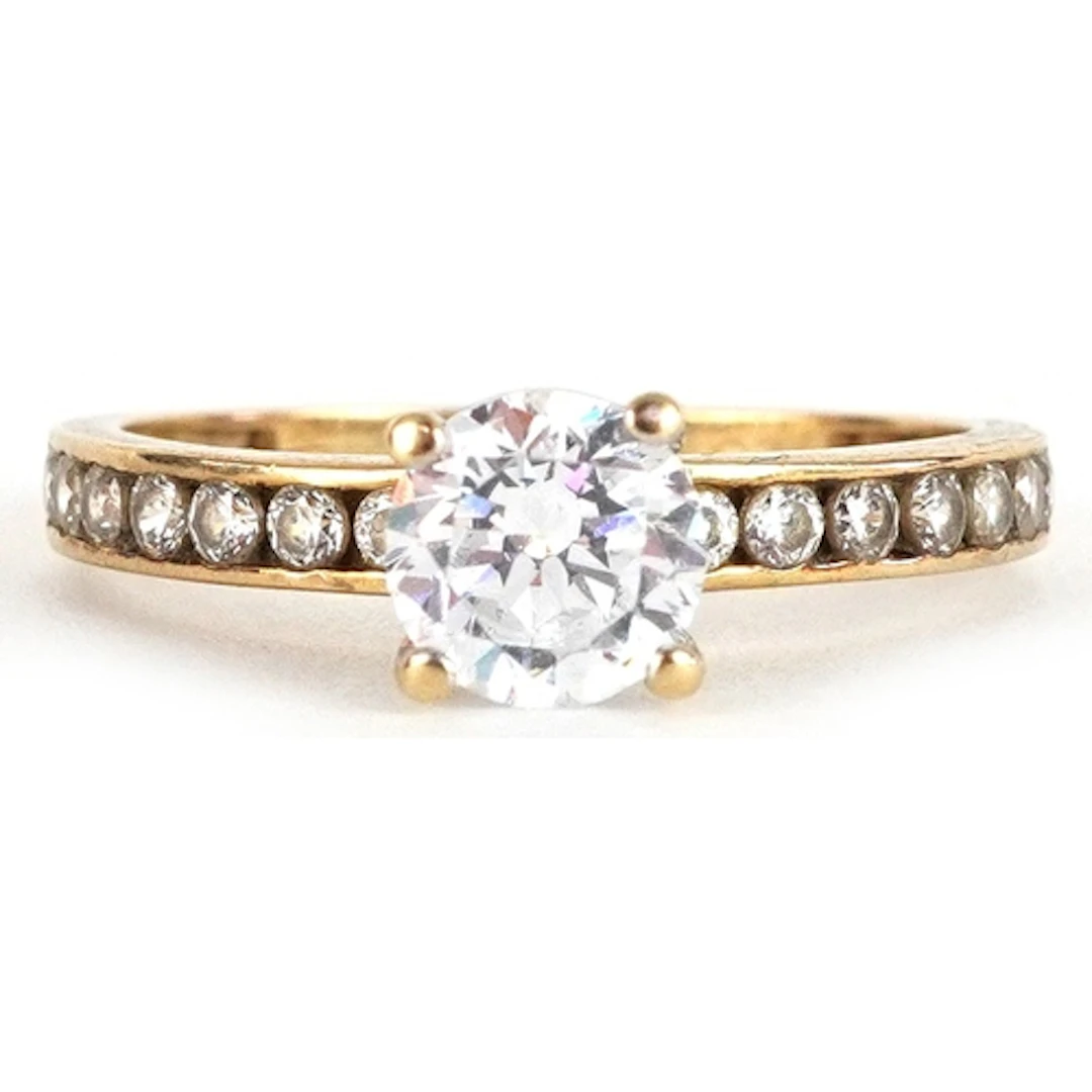 9ct gold cubic zirconia solitaire ring set with clear stones...