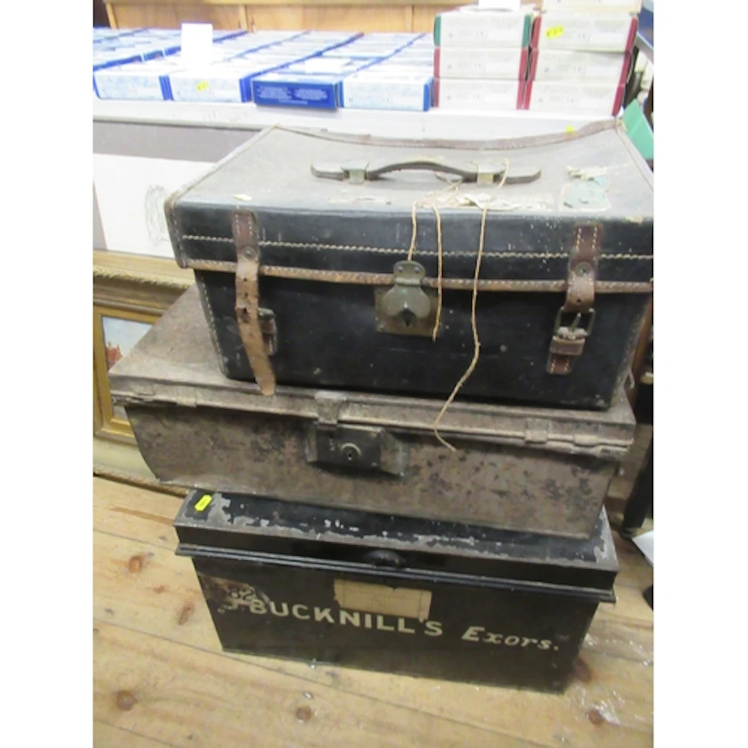 Two tin trunks, together with a leather covered case and a g...