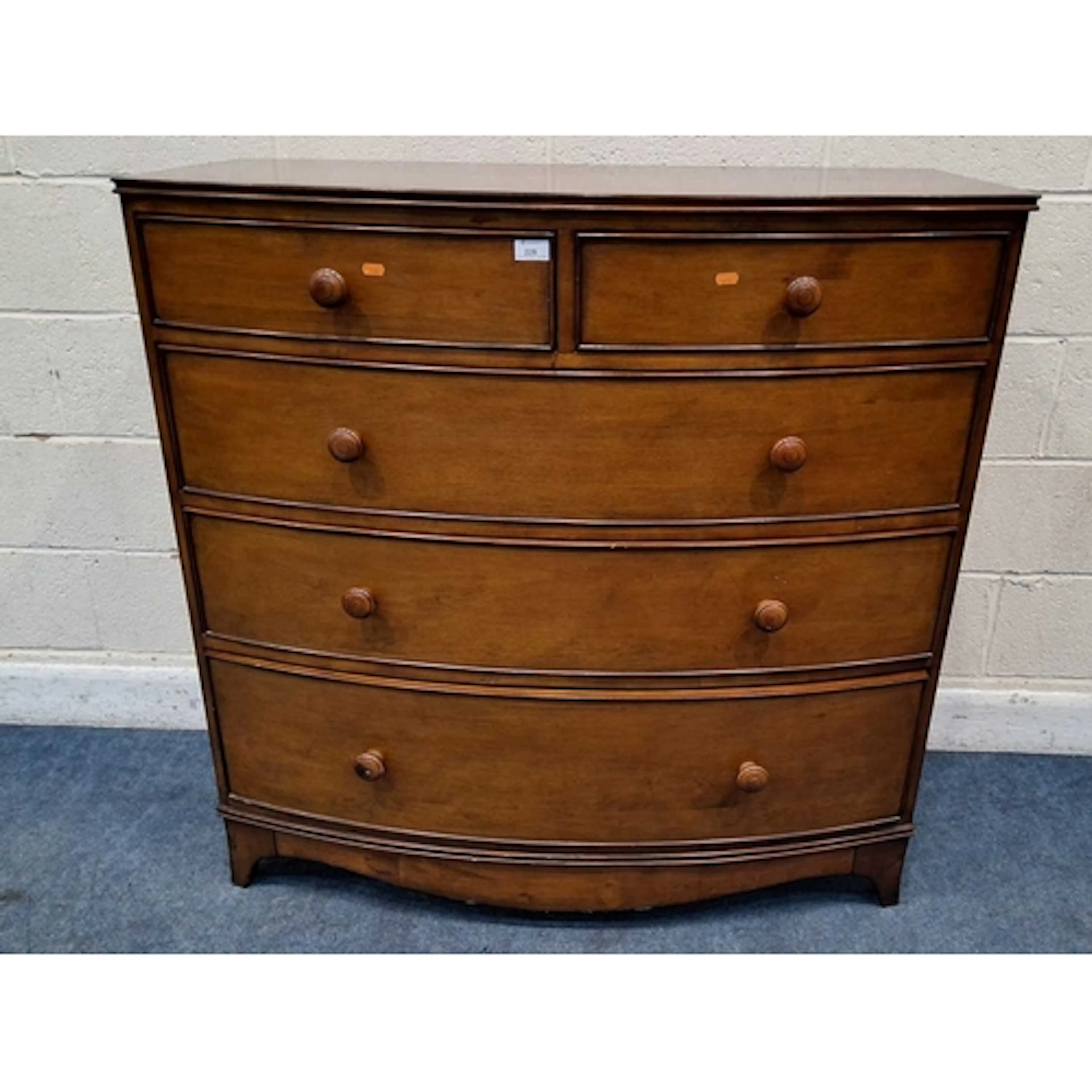 A REPRODUCTION BOW FRONT CHEST OF TWO SHORT OVER THREE LONG ...