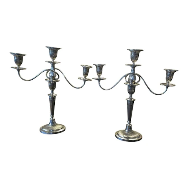 A pair of 20th century silver plated three branch candelabra...