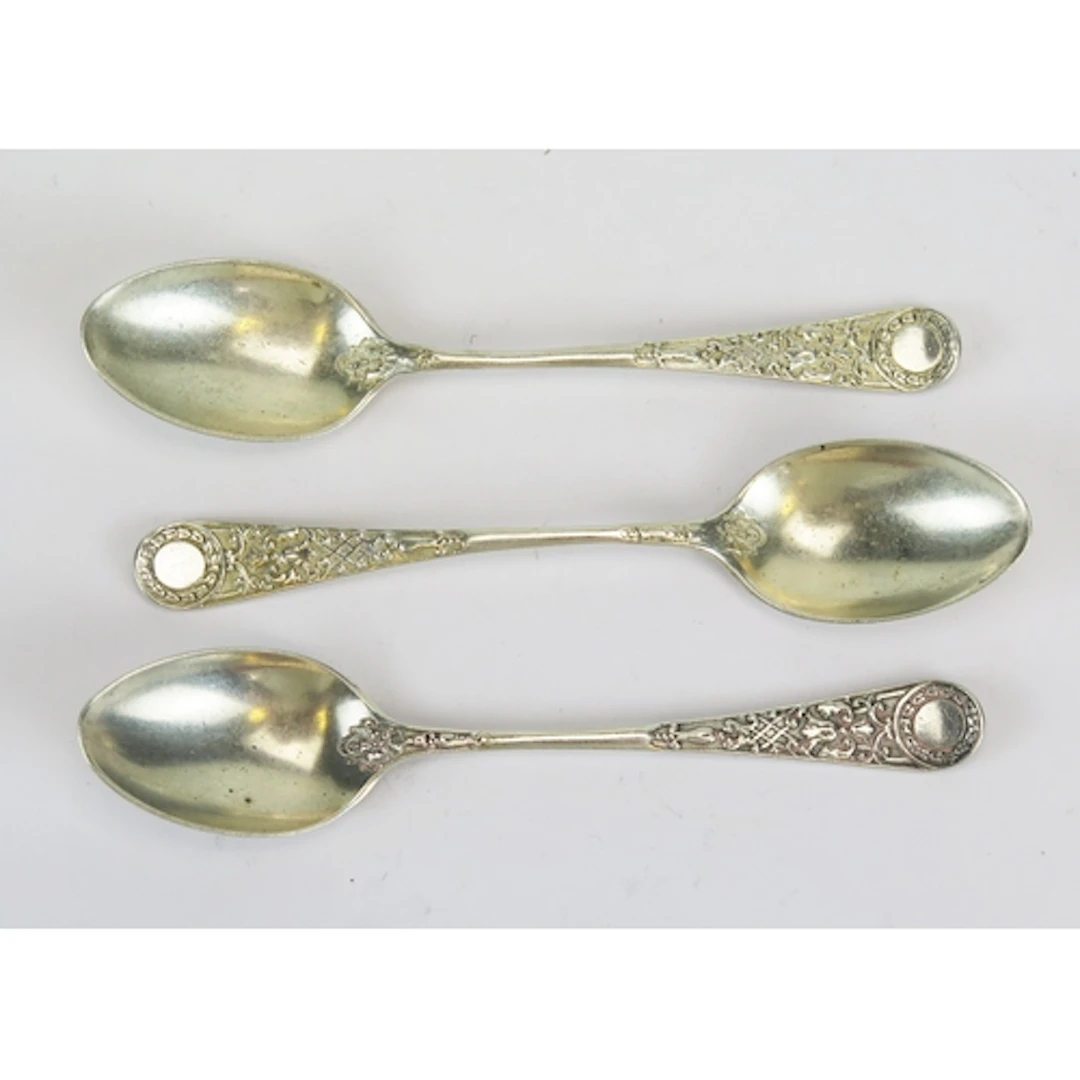 Three Victorian silver teaspoons with low relief decoration,...