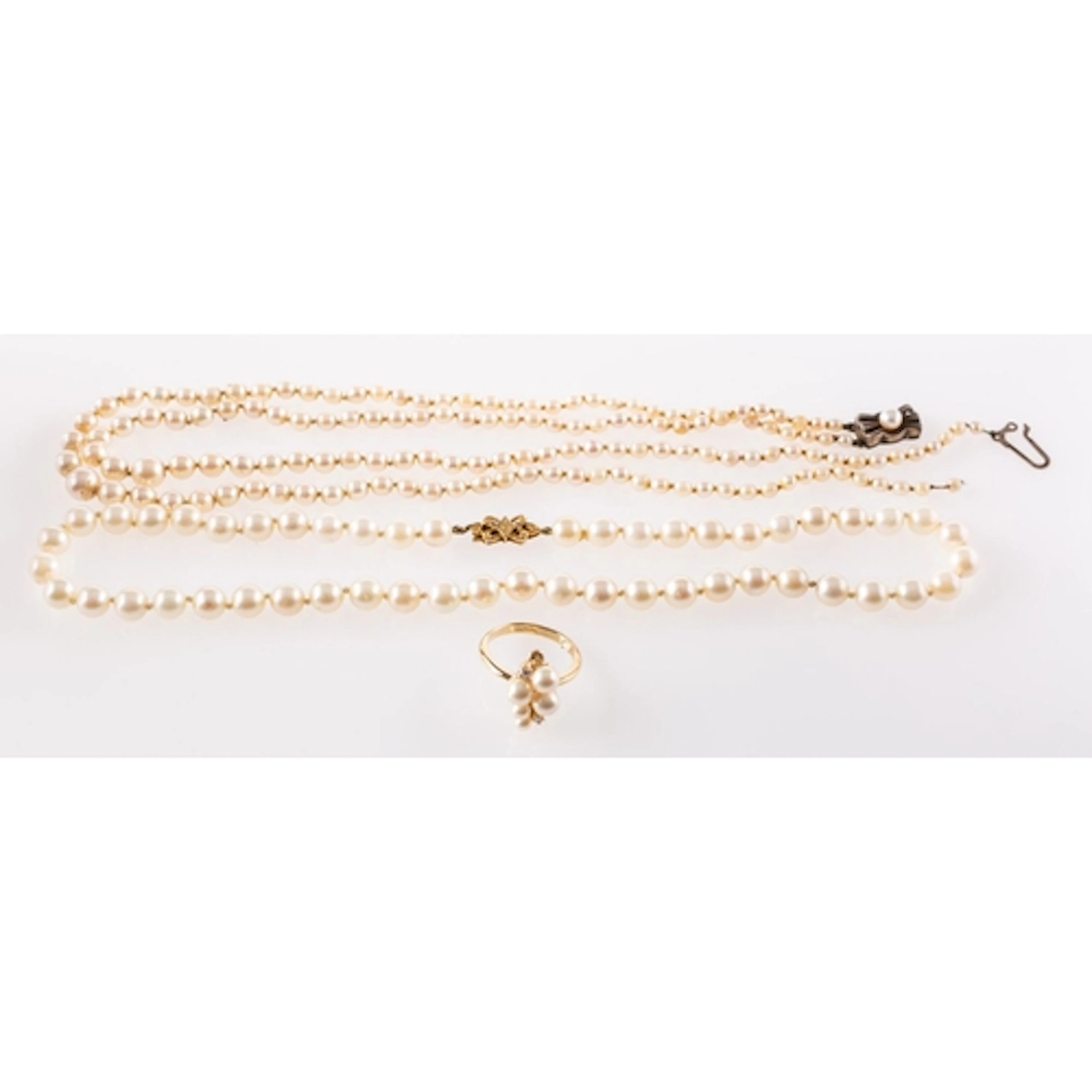 Two pearl necklaces and a Majorica pearl ring, a string of k...