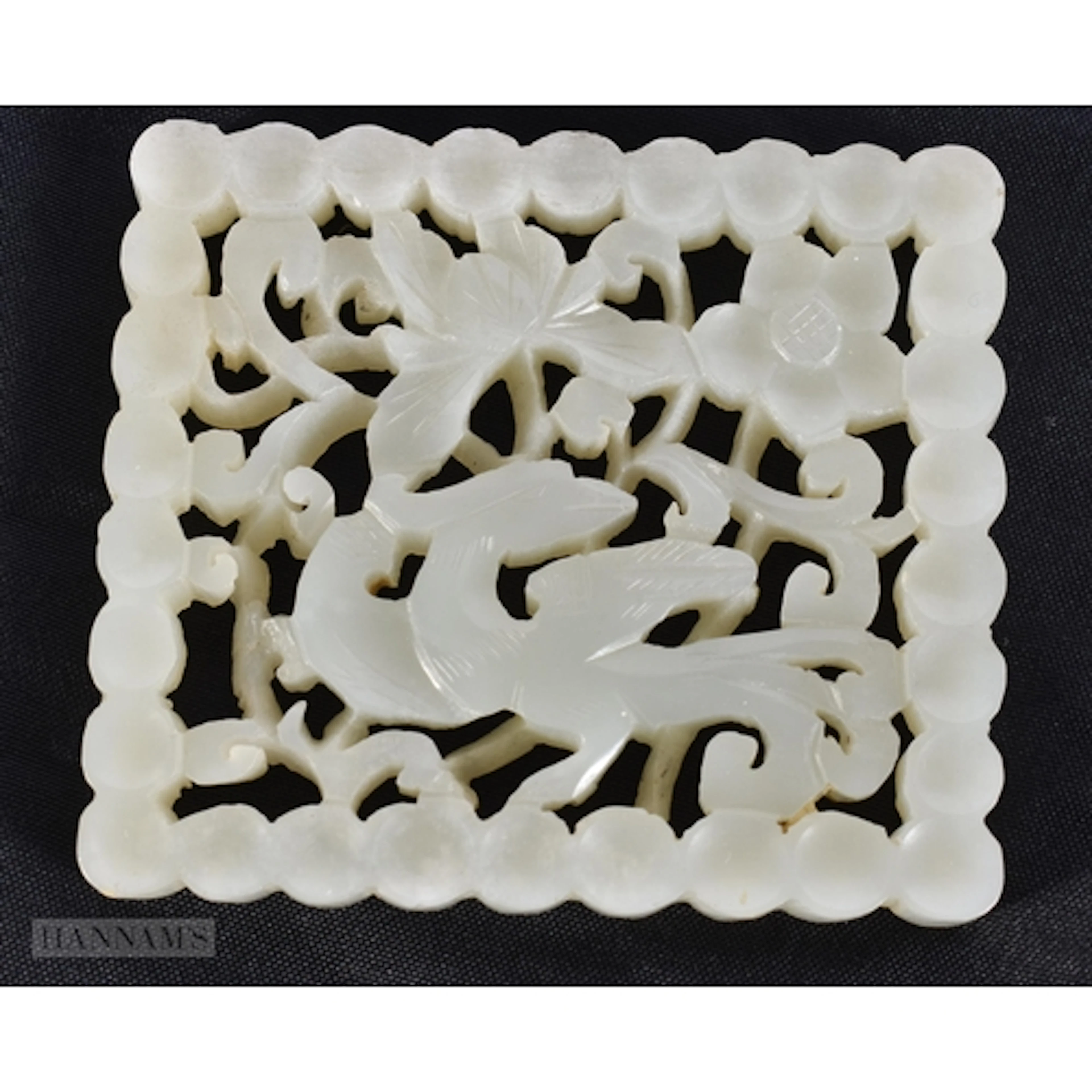 A CHINESE QING DYNASTY CARVED RETICULATED JADE PLAQUE. 6.5 c...