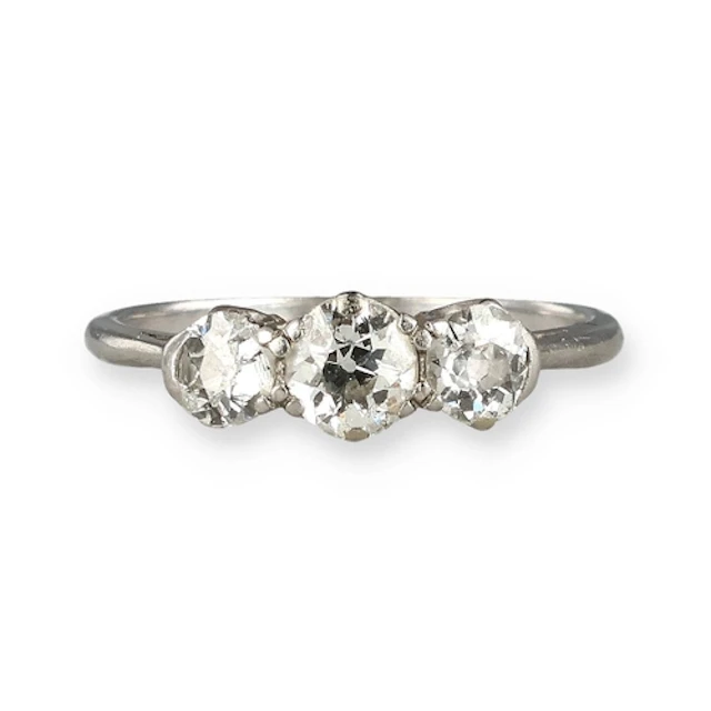 A PLATINUM THREE STONE DIAMOND RING Weight: 2.9gms Band mark...