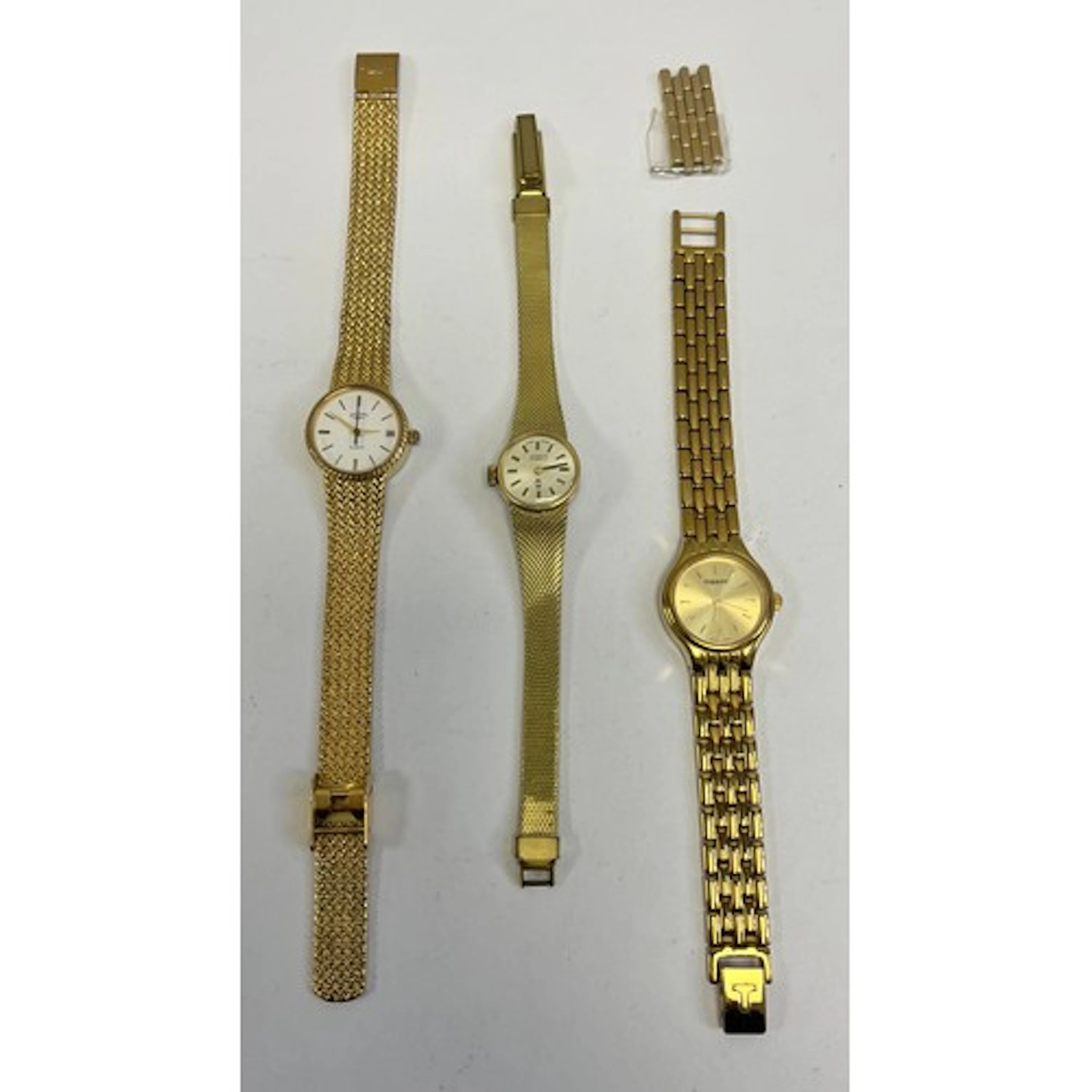 Three assorted ladies watches to include tissot and rotary.