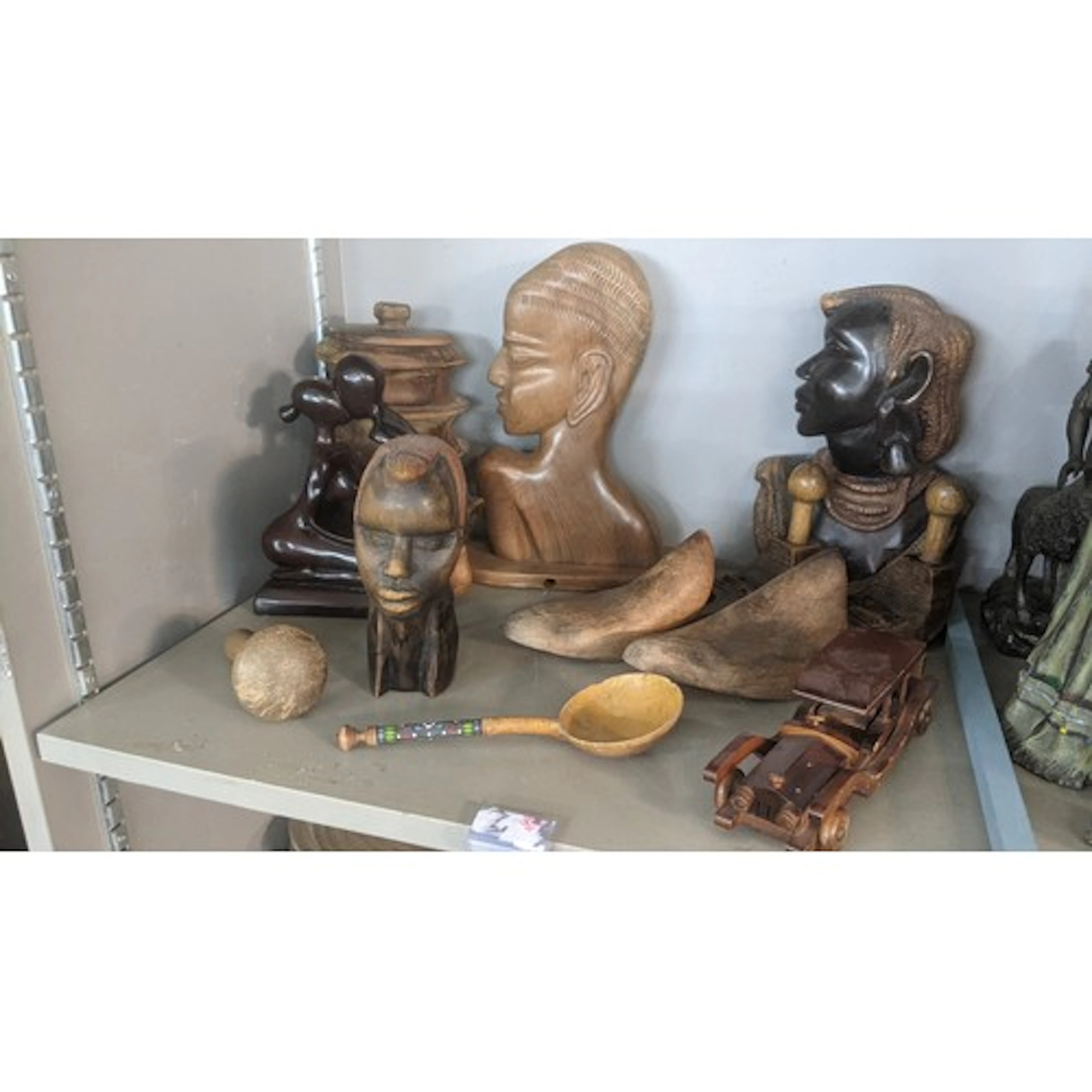 A collection of treen items to include an African Tribal bus...