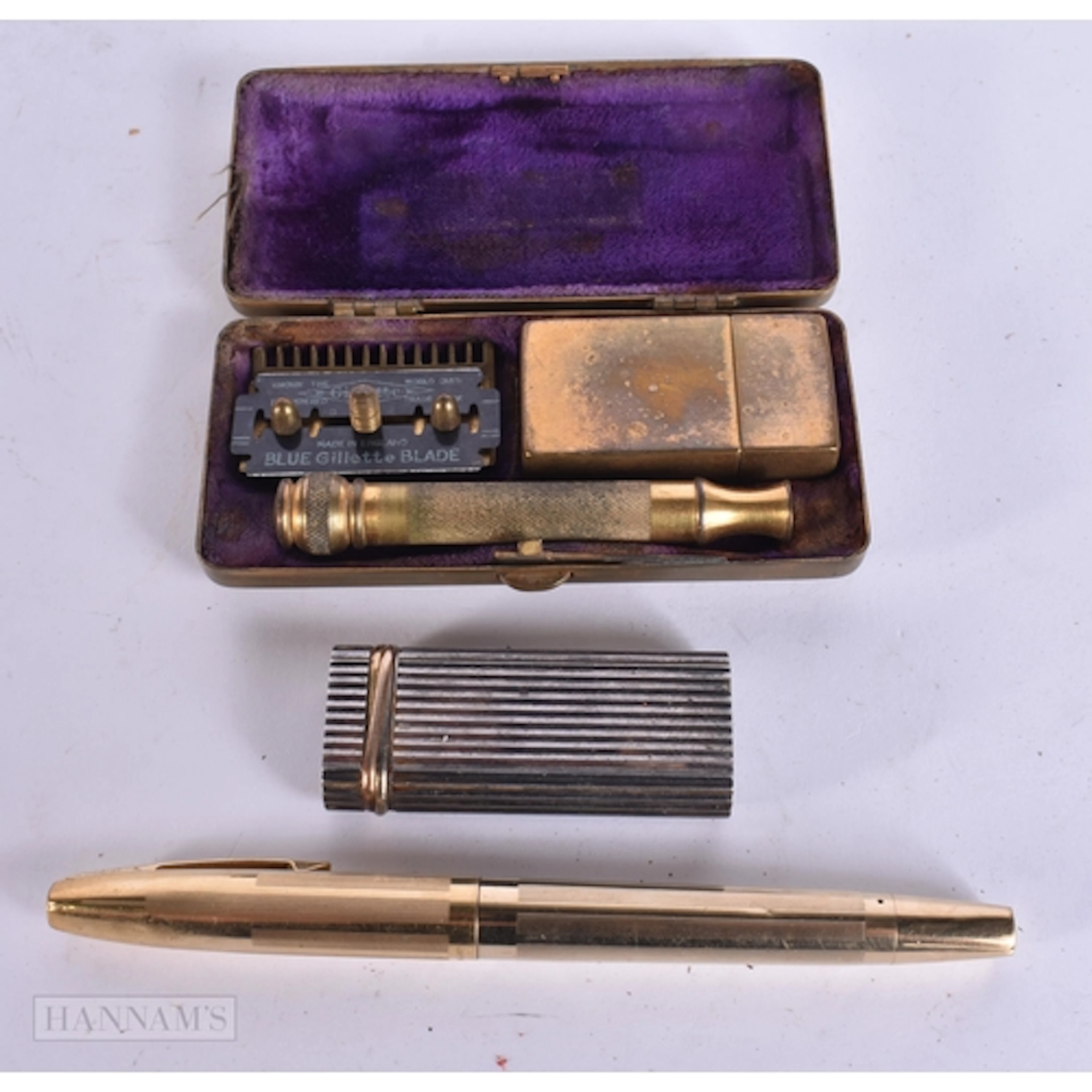 A SHEAFFER PEN together with a Cartier lighter, shaving kit ...
