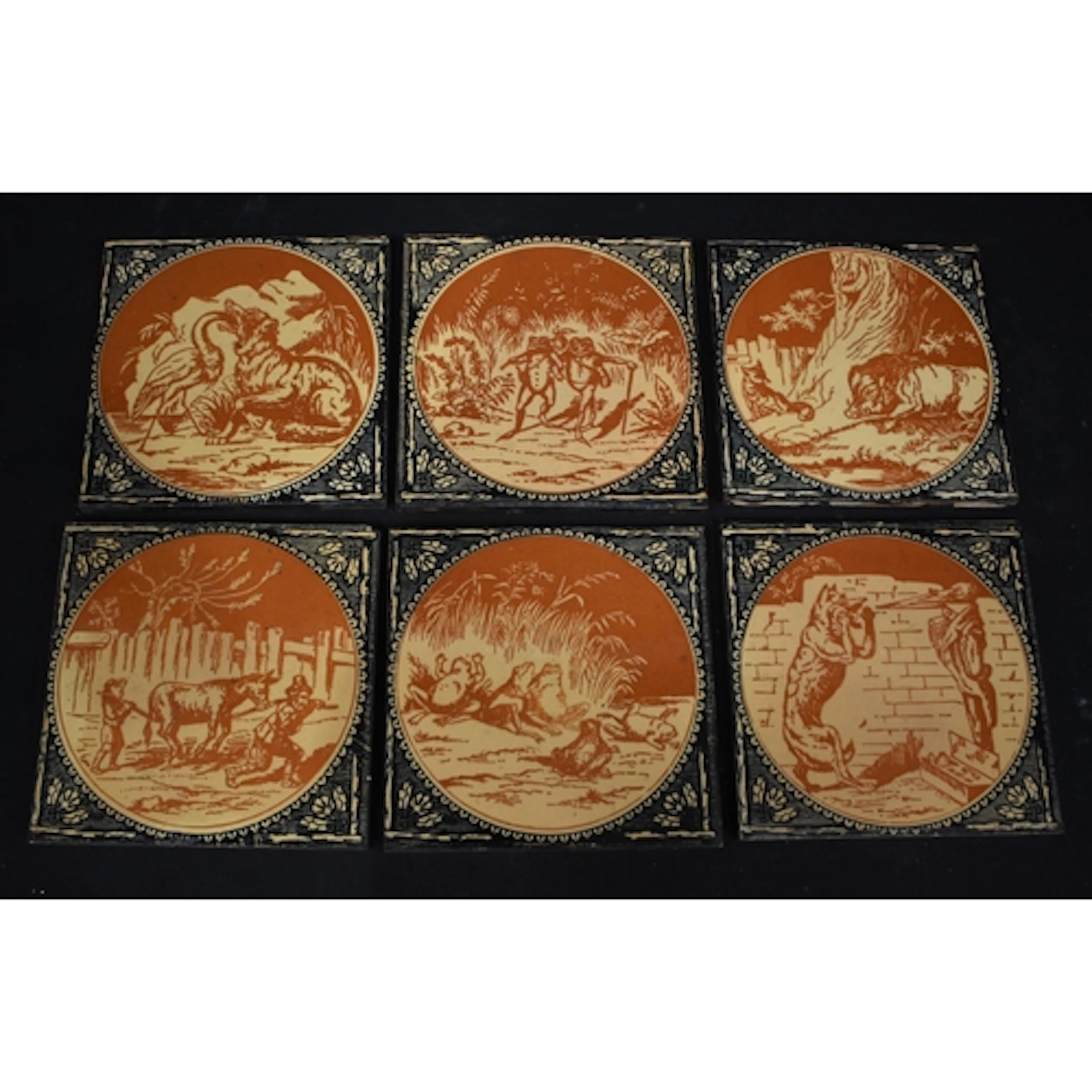 A collection of ceramic tiles depicting scenes from Aesop's ...