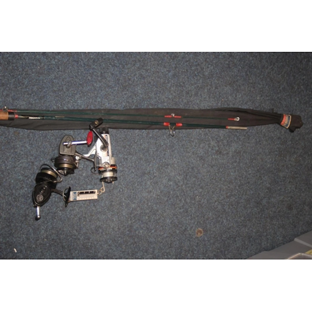 Group of fishing reels and fishing rods.