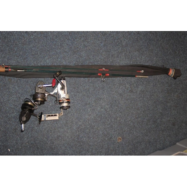 Group of fishing reels and fishing rods.