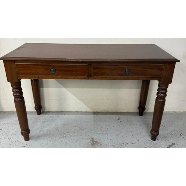 A mahogany two drawer side table on turned legs. Height 67 c...