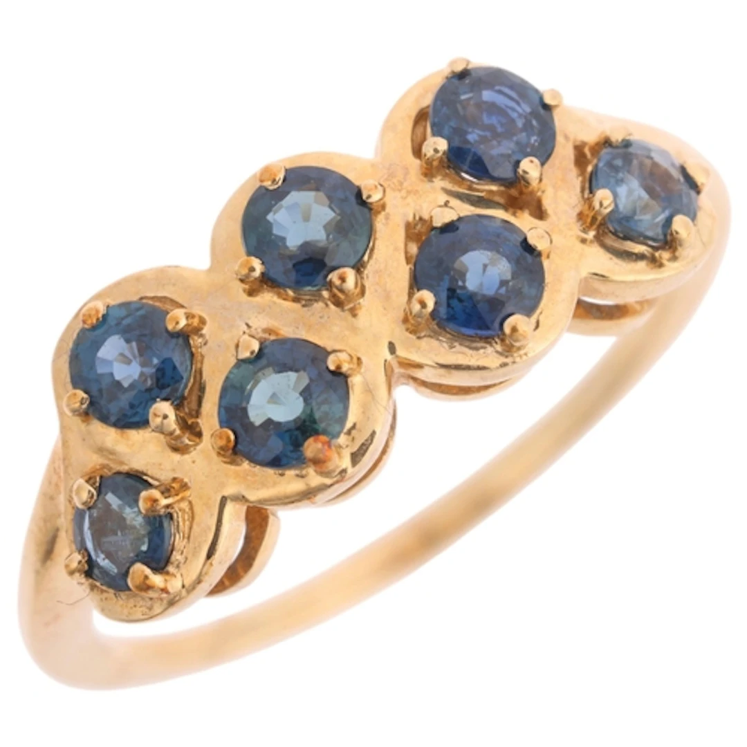 A 9ct gold seven stone sapphire ring, Gemporia, claw set wit...