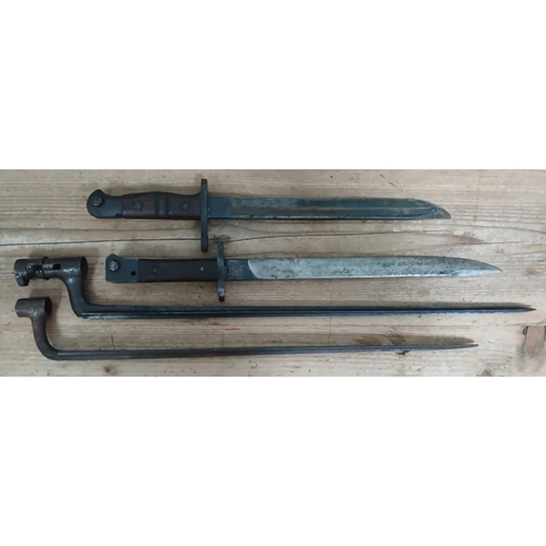 A group of four assorted bayonets lacking scabbards.